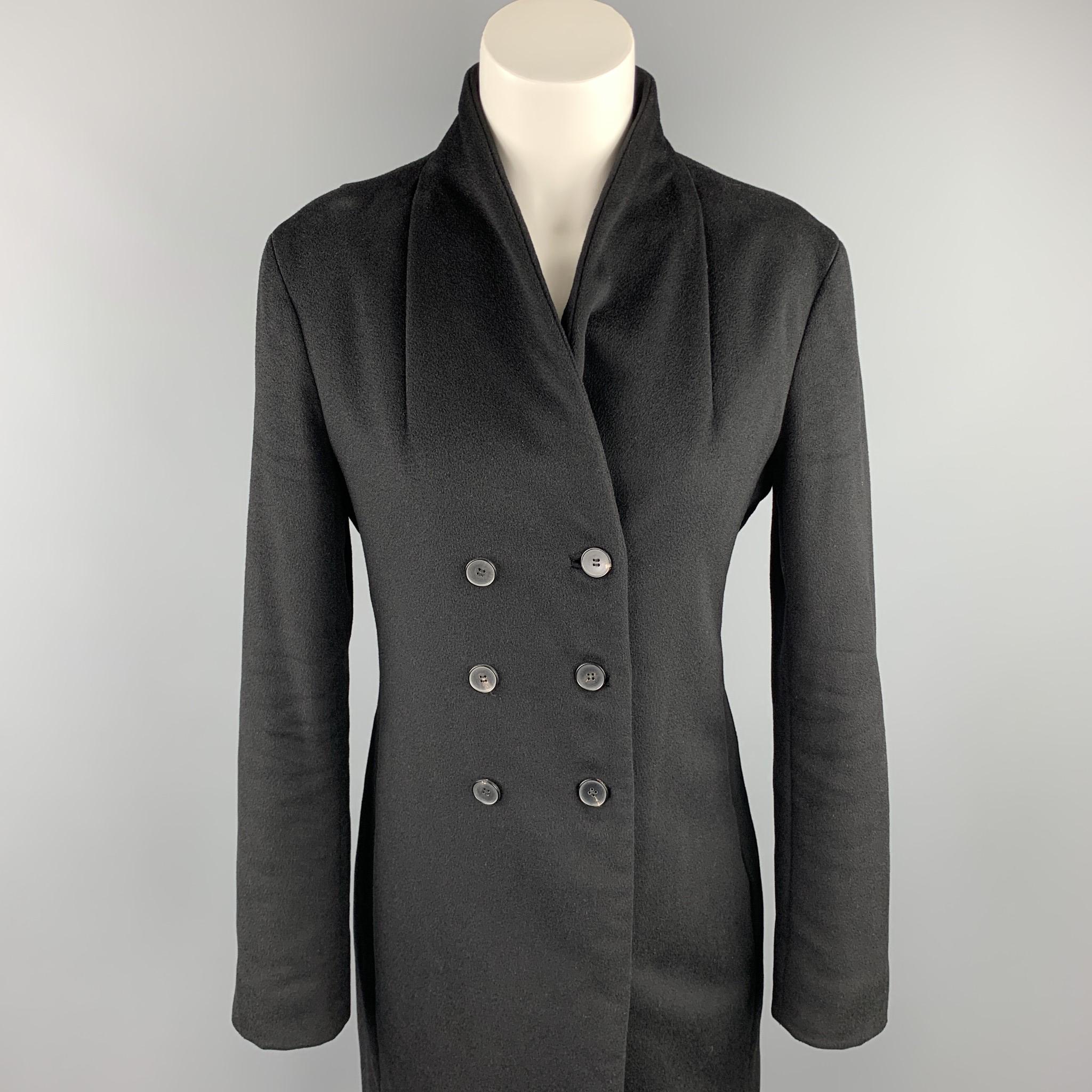 JIL SANDER coat comes in a black cashmere blend with a full black liner featuring a shawl collar, slit pockets, and a double breasted closure. Made in Italy.

Excellent Pre-Owned Condition.
Marked: 36
Original Retail Price: