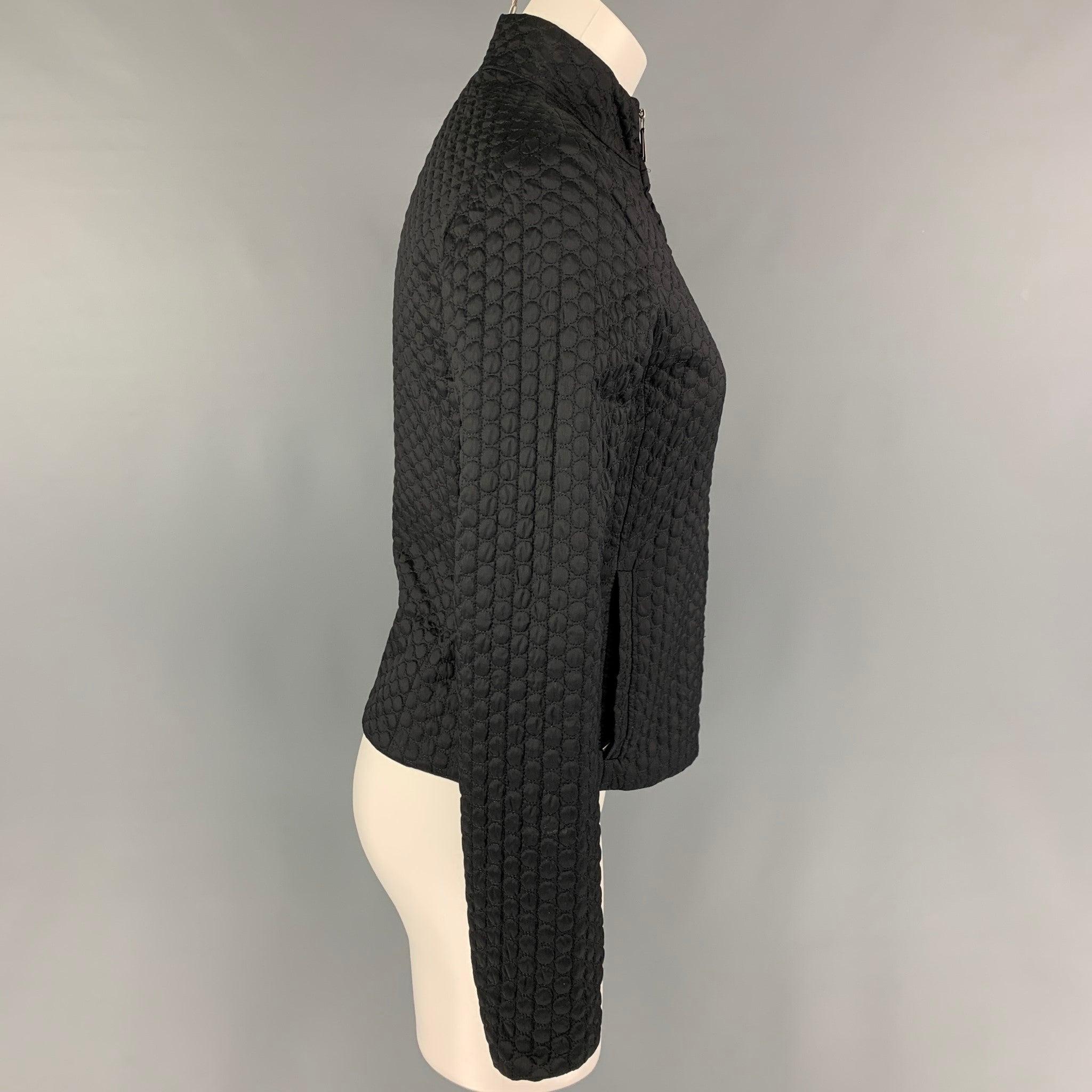 JIL SANDER jacket comes in a black textured polyester blend featuring a reversible style, high collar, slit pockets, and a full zip up closure. Made in Italy.
Very Good
Pre-Owned Condition. 

Marked:   34 

Measurements: 
 
Shoulder: 15.5 inches 