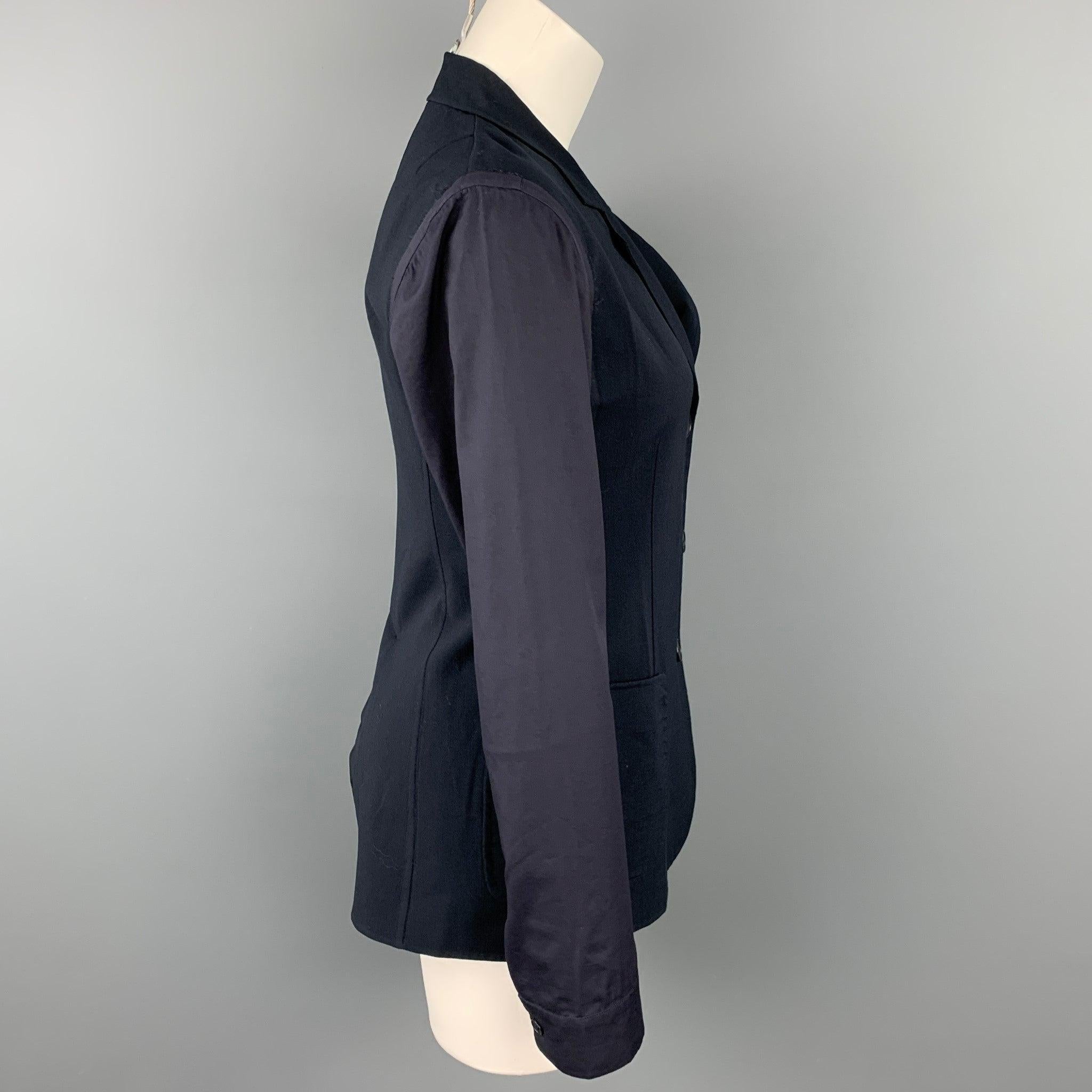 JIL SANDER blazer comes in a navy two toned virgin wool featuring a notch lapel, patch pockets, and a buttoned closure. Made in Italy.Very Good
Pre-Owned Condition. 

Marked:   34 

Measurements: 
 
Shoulder: 15.5 inches  Bust: 32 inches Sleeve: 25