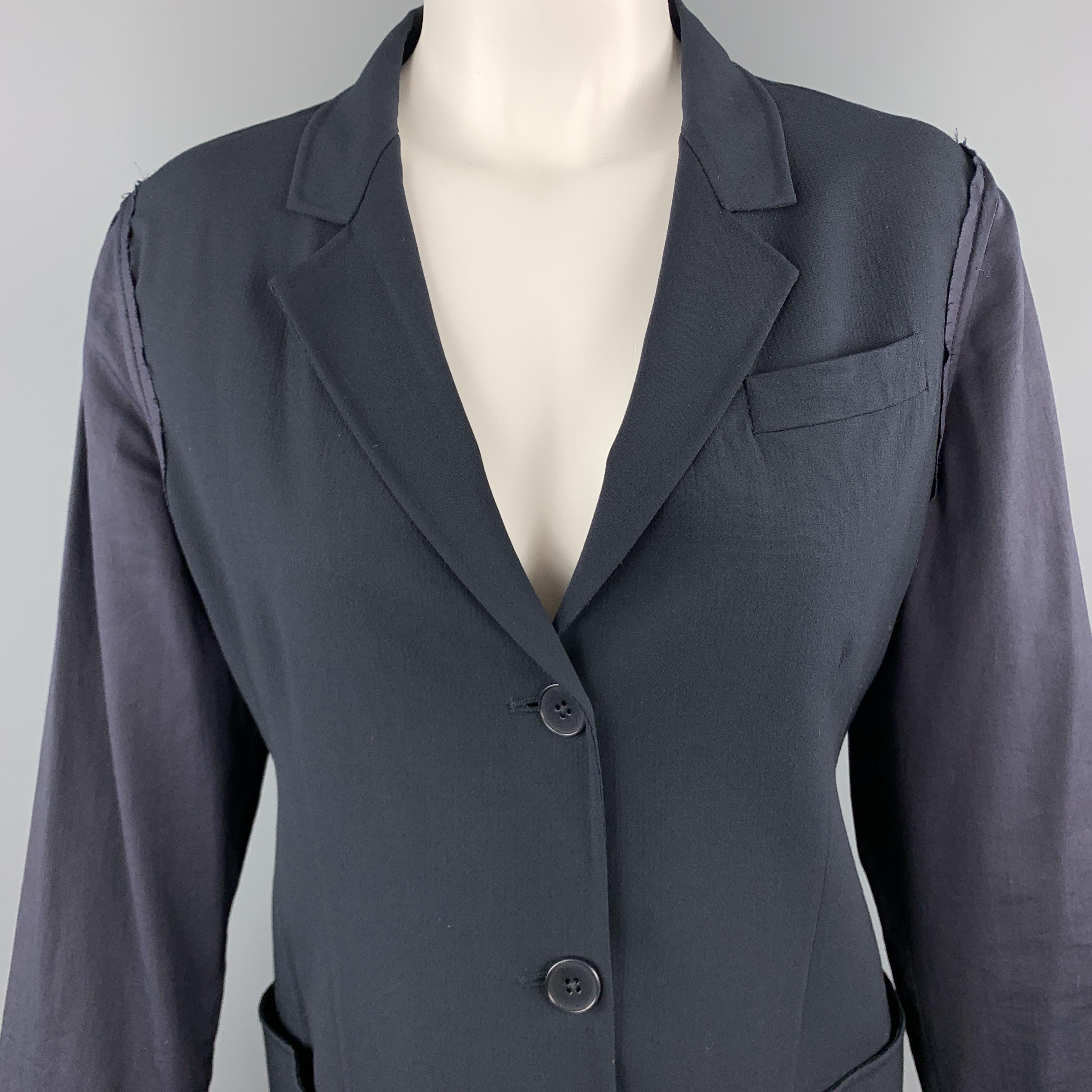 JIL SANDER blazer comes in navy wool blend fabric with a notch lapel, single breasted three button front, patch pockets, and silk blend frayed edge sleeves. Made in Italy.

Excellent Pre-Owned Condition.
Marked: IT 36

Measurements:

Shoulder: 16