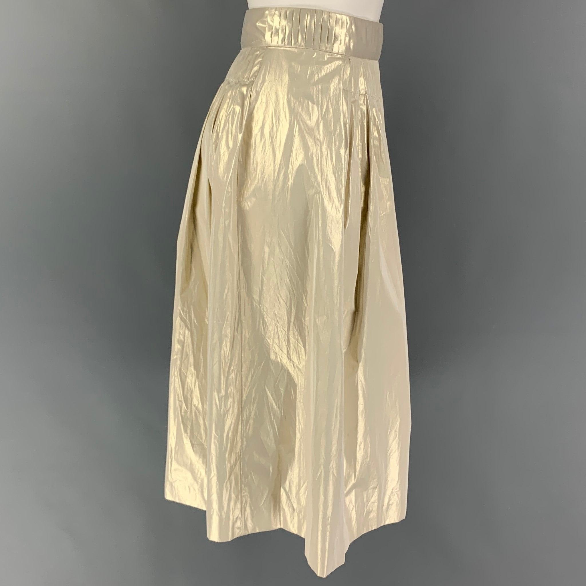 JIL SANDER skirt comes in a platinum polyester featuring a pleated style and a side zipper closure. Made in Italy.
Very Good
Pre-Owned Condition. 

Marked:   34 

Measurements: 
  Waist: 28 inches  Hip: 38 inches  Length: 26 inches 
  
  
