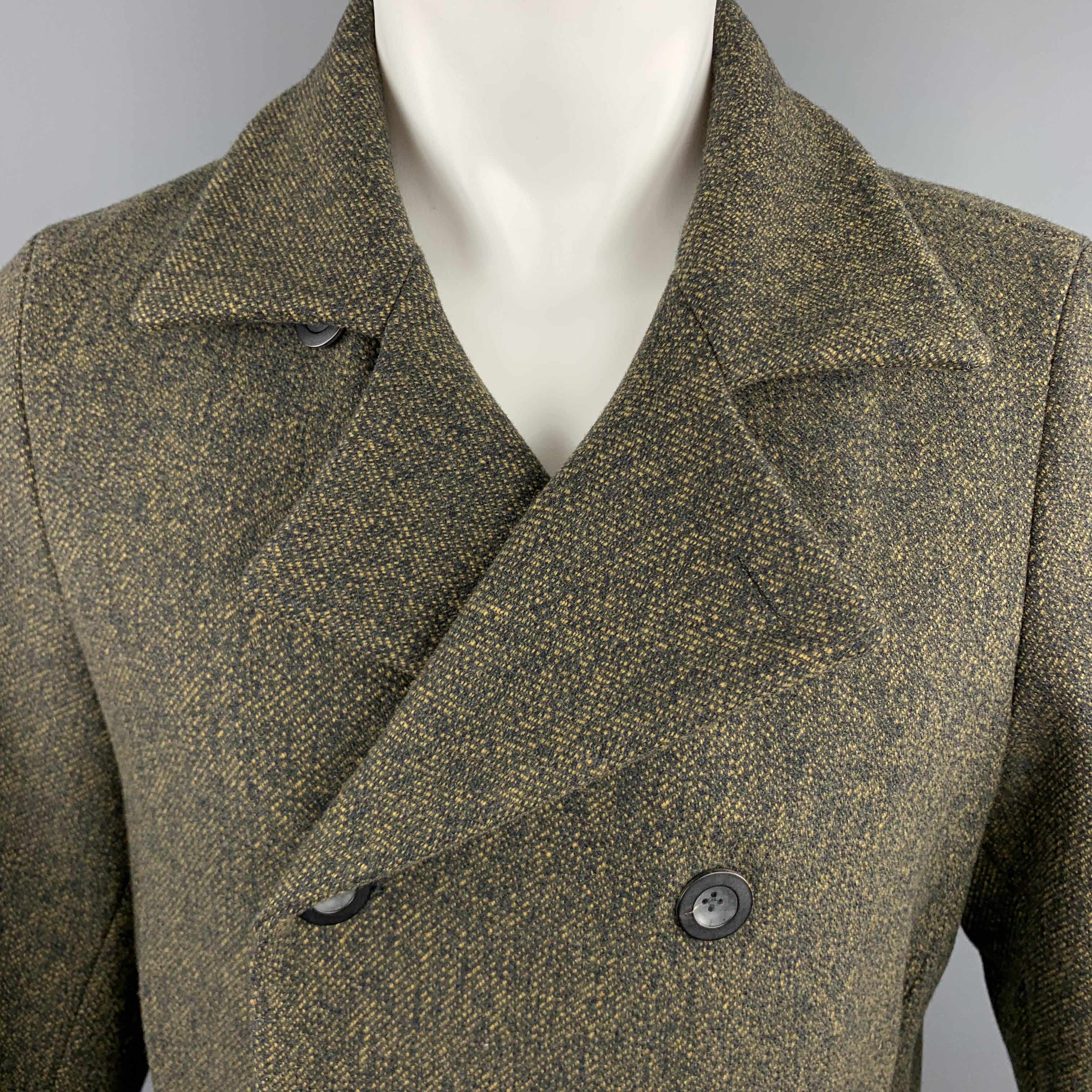 JIL SANDER cropped peacoat comes in olive heathered woven virgin wool with a pointed lapel, double breasted button front, and slanted pockets. Made in Italy.

Excellent Pre-Owned Condition.
Marked: IT 50

Measurements:

Shoulder: 16 in.
Chest: 44