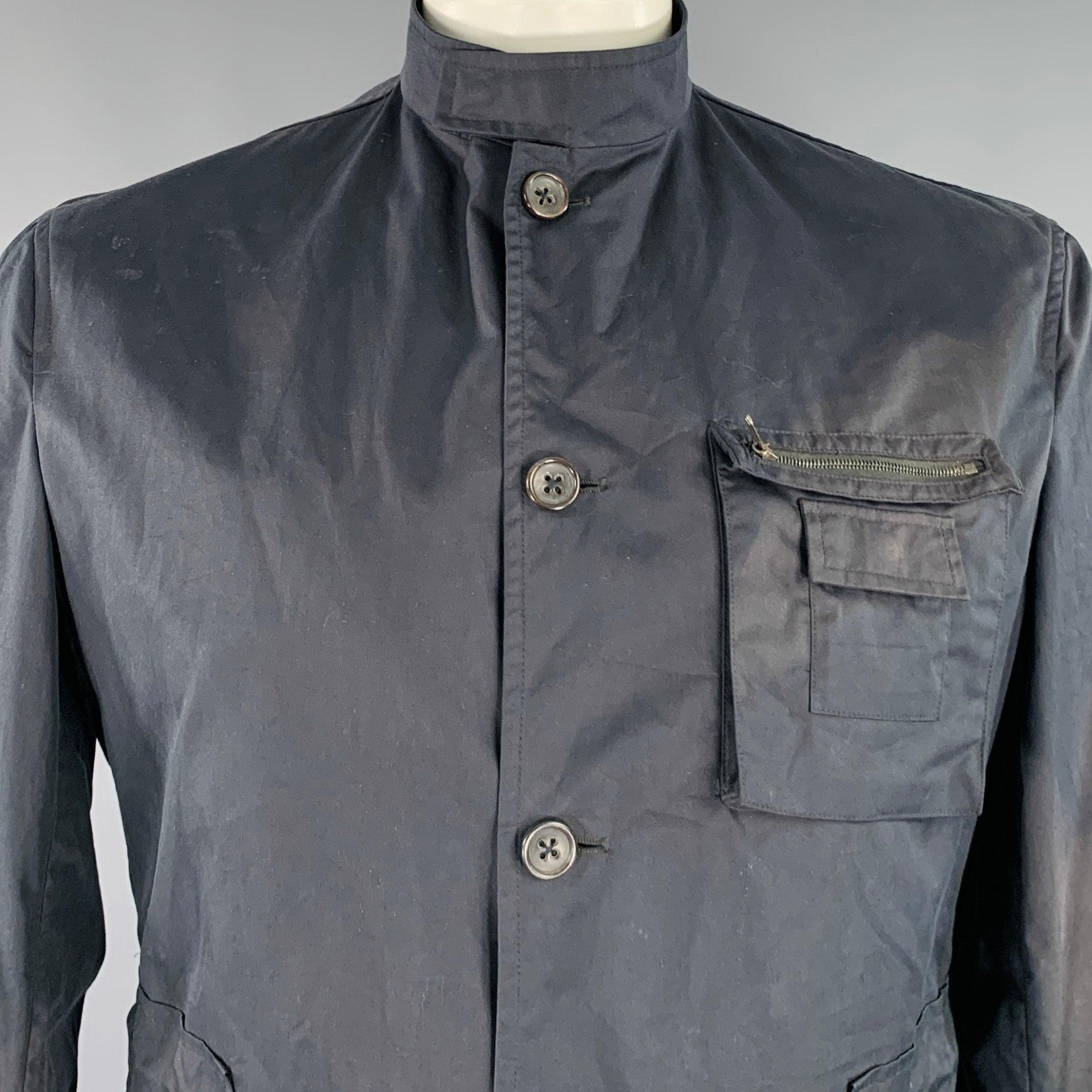 JIL SANDER jacket
in a black woven fabric featuring a parka style, multiple utilitarian zip pockets, and button closure. Good Pre-Owned Condition. Moderate discoloration, as is. 

Marked:   size not marked, tags removed. 

Measurements: 
 
Shoulder: