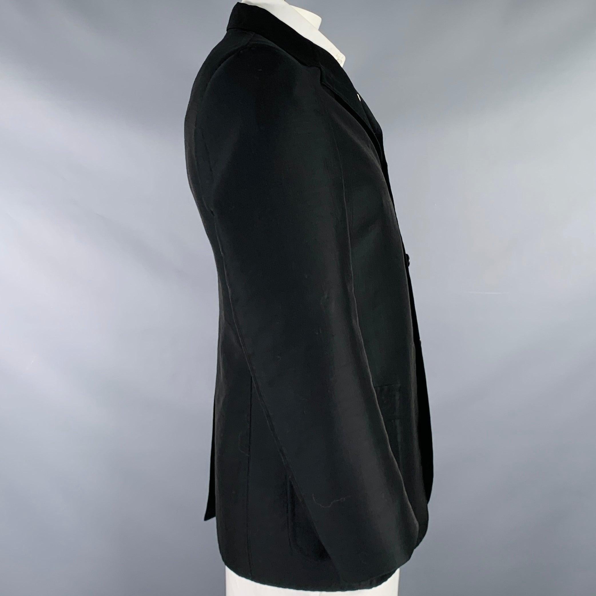 JIL SANDER sport coat
in a black wool blend fabric featuring notch lapel, single vented back, and three button closure. Made in Italy.Excellent Pre-Owned Condition. 

Marked:   L 

Measurements: 
 
Shoulder: 18.5 inches Chest: 42 inches Sleeve: 25