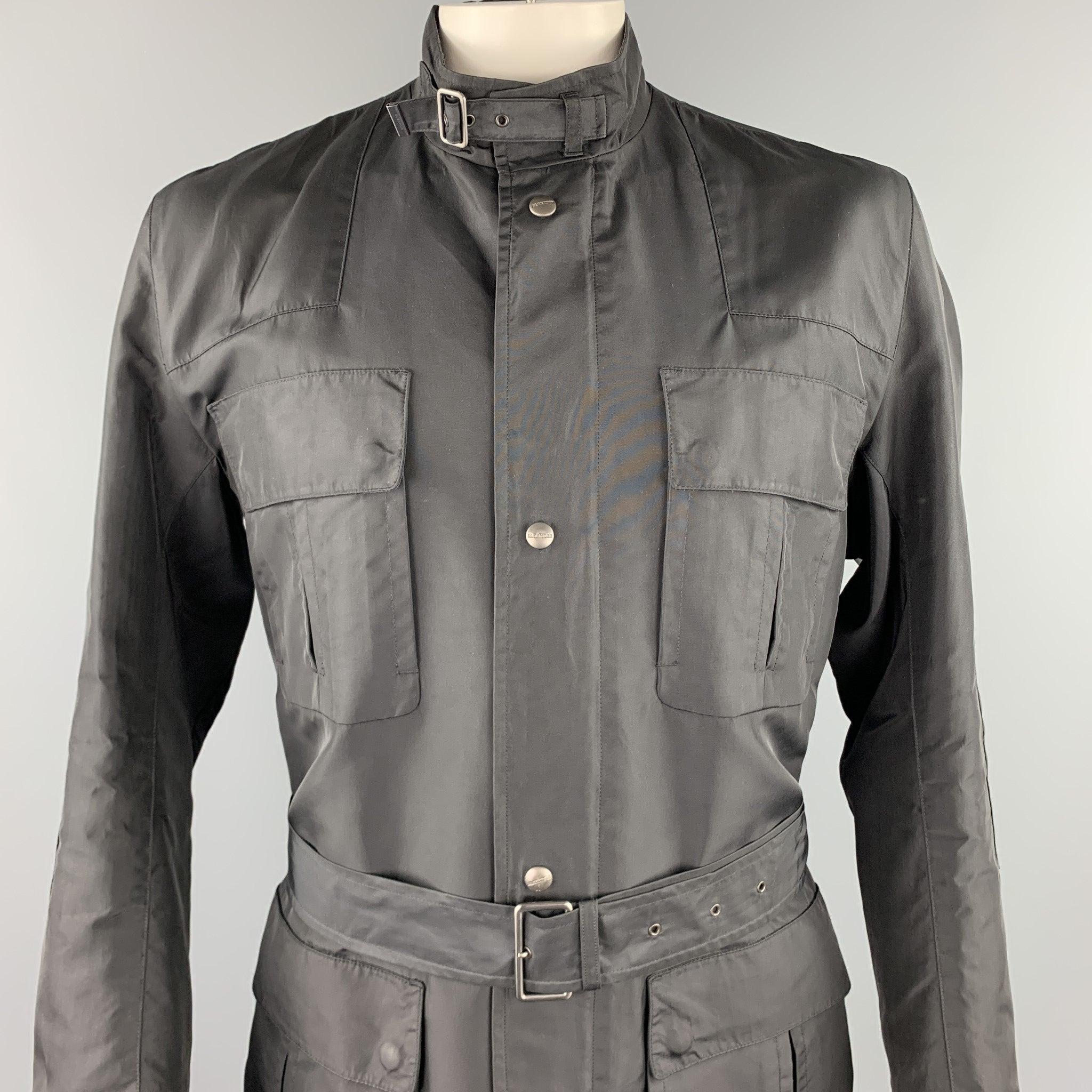JIL SANDER jacket comes in a black poliammide featuring a belted style, flap pockets, belted collar, and a zip 7 snap button closure. Made in Italy.Excellent
Pre-Owned Condition. 

Marked:   IT 54 

Measurements: 
 
Shoulder: 18.5 inches 
Chest: 44