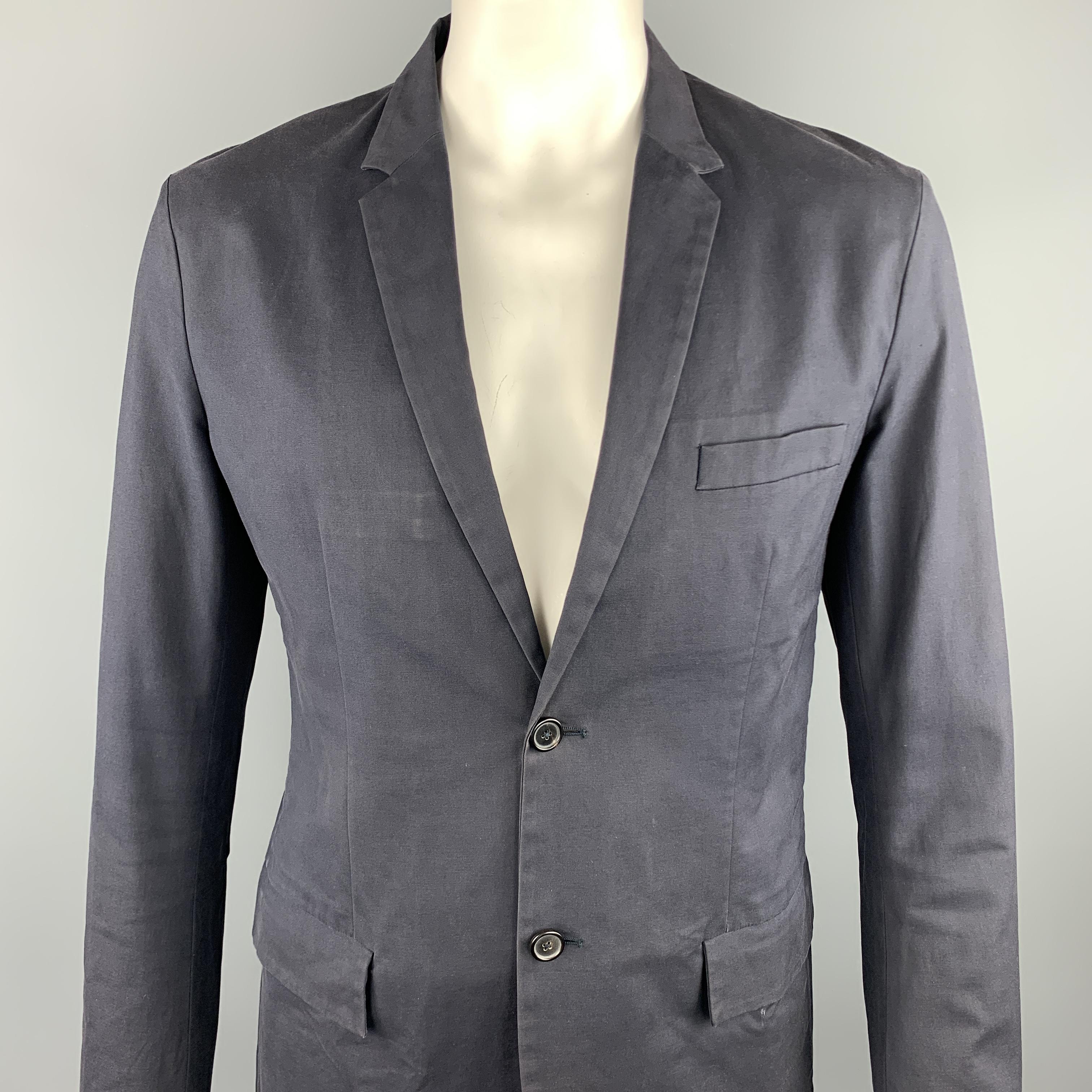 JIL SANDER sport coat comes in a navy cotton blend featuring a notch lapel style, flap pockets, and a two button closure. As-Is. Made in Italy.

Good Pre-Owned Condition.
Marked: IT 54

Measurements:

Shoulder: 19 in. 
Chest: 44 in. 
Sleeve: 28 in.