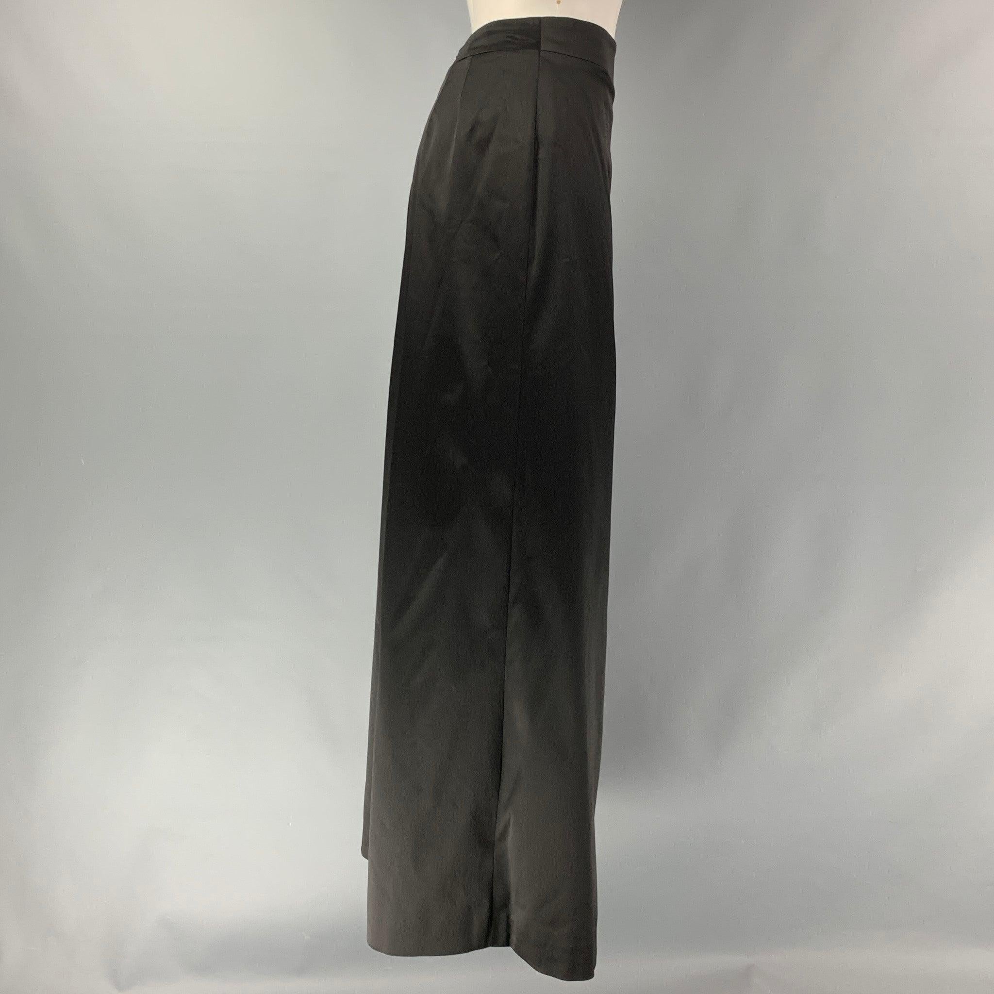 JIL SANDER evening skirt comes in black acetate blend satin fabric featuring a A-line silhouette, and a center back invisible zip up closure. Made in Italy.Excellent Pre-Owned Condition. 

Marked:   36 

Measurements: 
  Waist: 26 inches Hip: 40