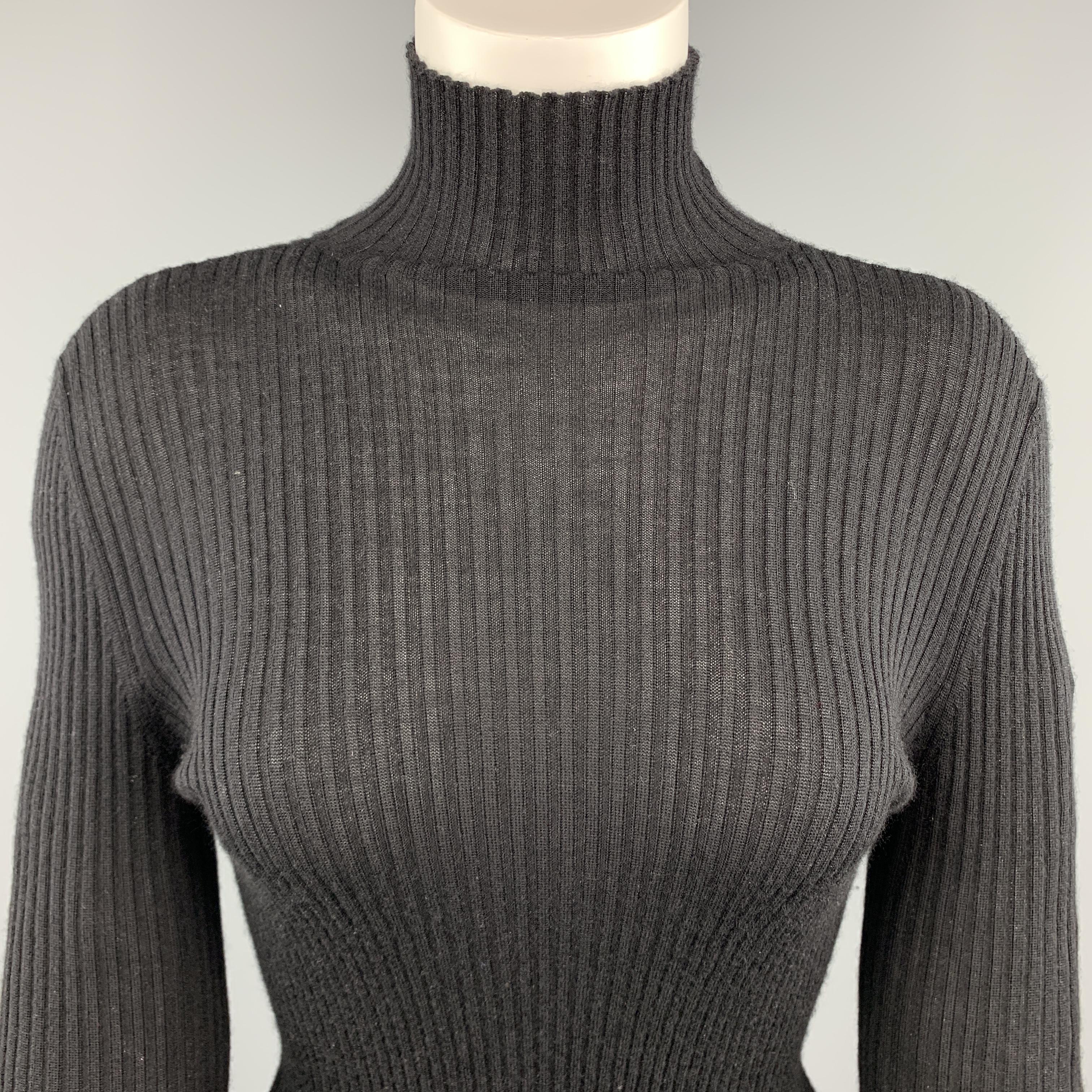JIL SANDER pullover sweater comes in sheer cashmere silk blend ribbed nit with a stand up turtleneck collar. Made in Italy.

Excellent Pre-Owned Condition.
Marked: IT 42

Measurements:

Shoulder: 15 in.
Bust: 34 in.
Sleeve: 28 in.
Length: 26.5 in. 