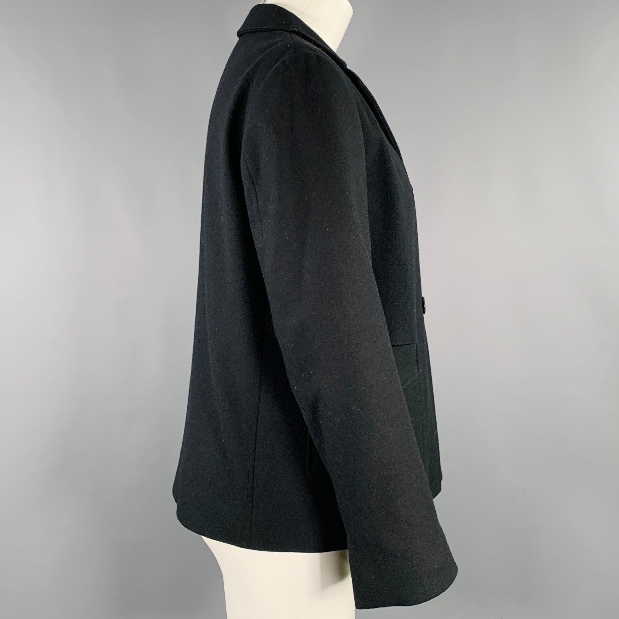 JIL SANDER jacket
in a black virgin wool featuring a double breasted style, two patchy pockets, and button closure. Made in Italy.Excellent Pre-Owned Condition. 

Marked:   IT 42 

Measurements: 
 
Shoulder: 16 inches Bust: 41 inches Sleeve: 22.5