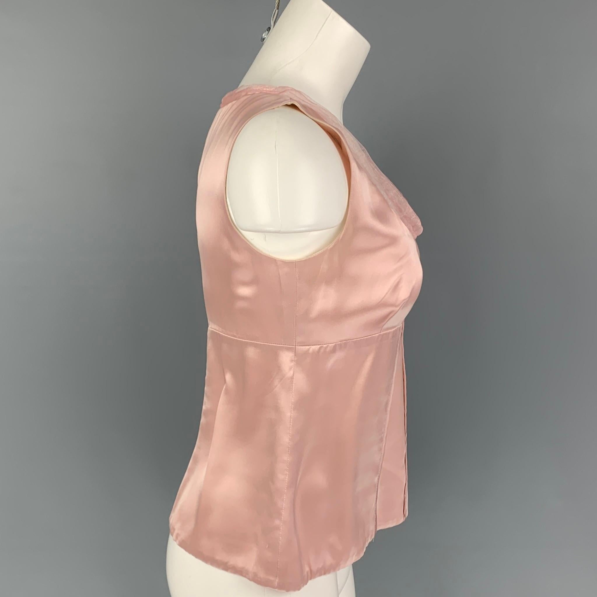 JIL SANDER top comes in a pink silk featuring a mesh trim and a side zipper closure. Made in Italy. 

Good Pre-Owned Condition. Moderate discoloration at inner collar. As-Is.
Marked: 36

Measurements:

Shoulder: 13 in.
Bust: 31 in.
Length: 19 in. 