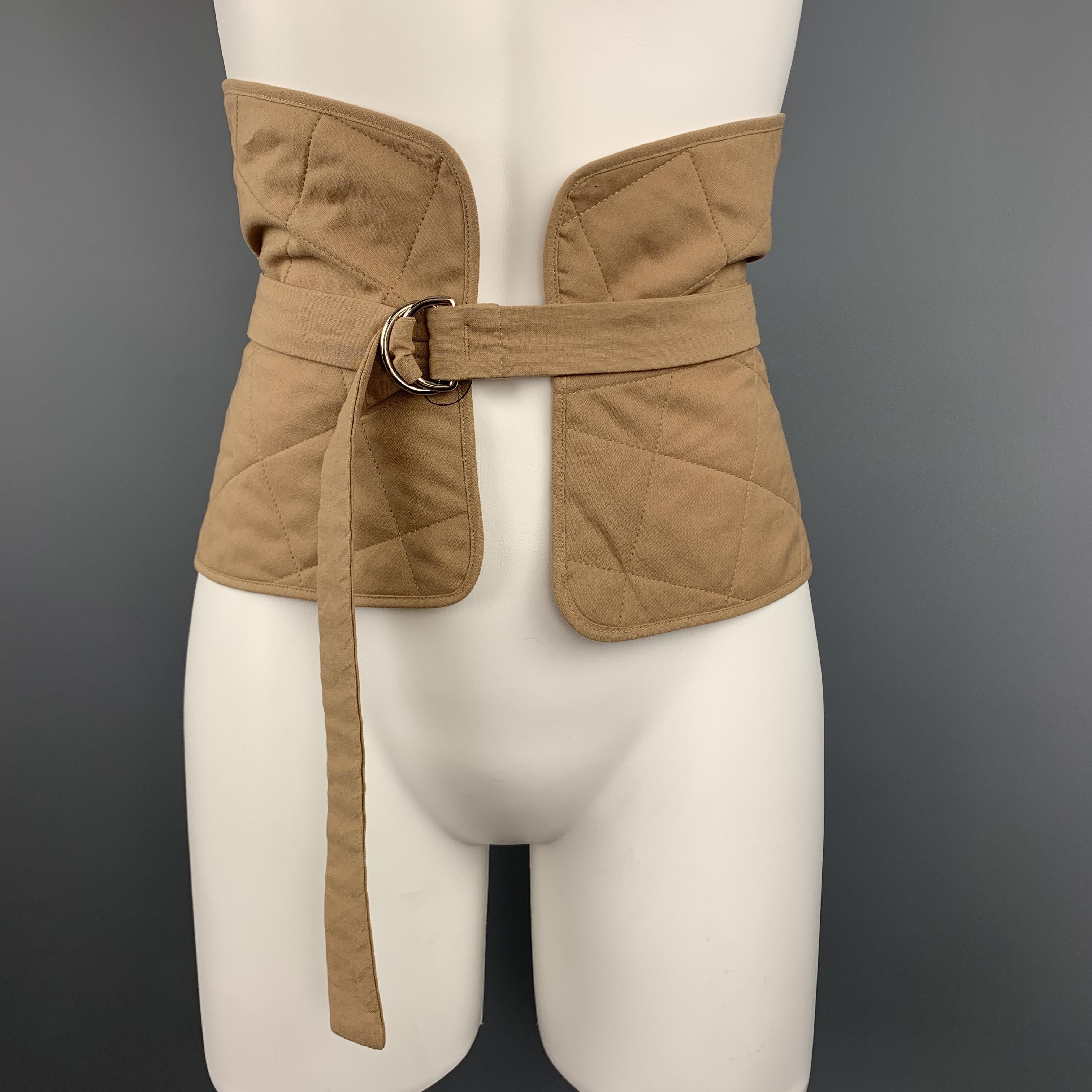 JIL SANDER Resort 2018 waist belt comes features a thick quilted cotton canvas band with adjustable belt overlay with D loop closures. Made in Italy.

New with Tags.
Marked: IT 42
Original Retail Price: $460.00

Measurements:

Length: 45 in.
Width:
