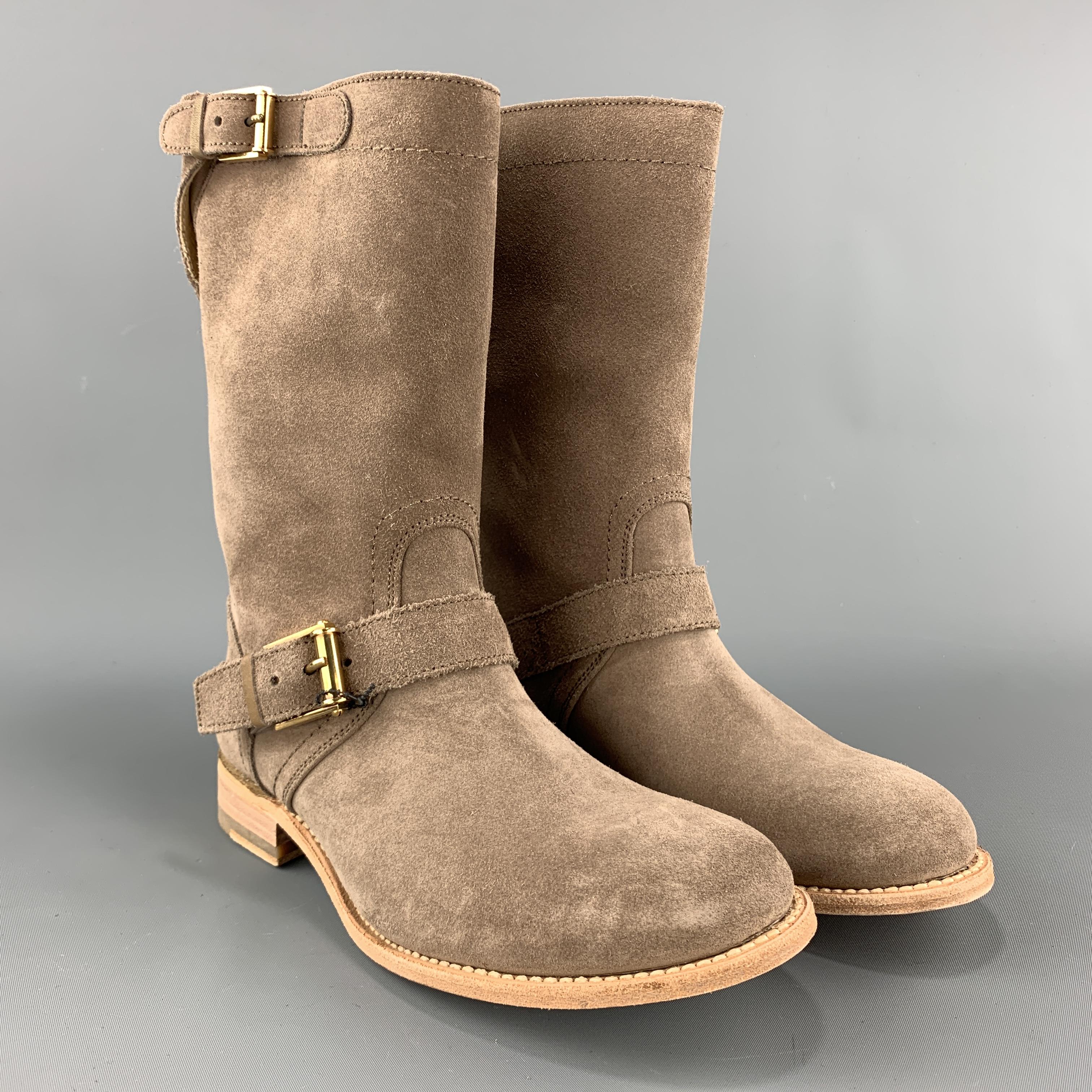 JIL SANDER biker style boots come in taupe suede with ankle strap, gold tone buckles, and tan sole. With box. Made in Spain.

Brand New. 
Marked: IT 37

Outsole: 10.25 x 3.75 in.
Length: 10 in.