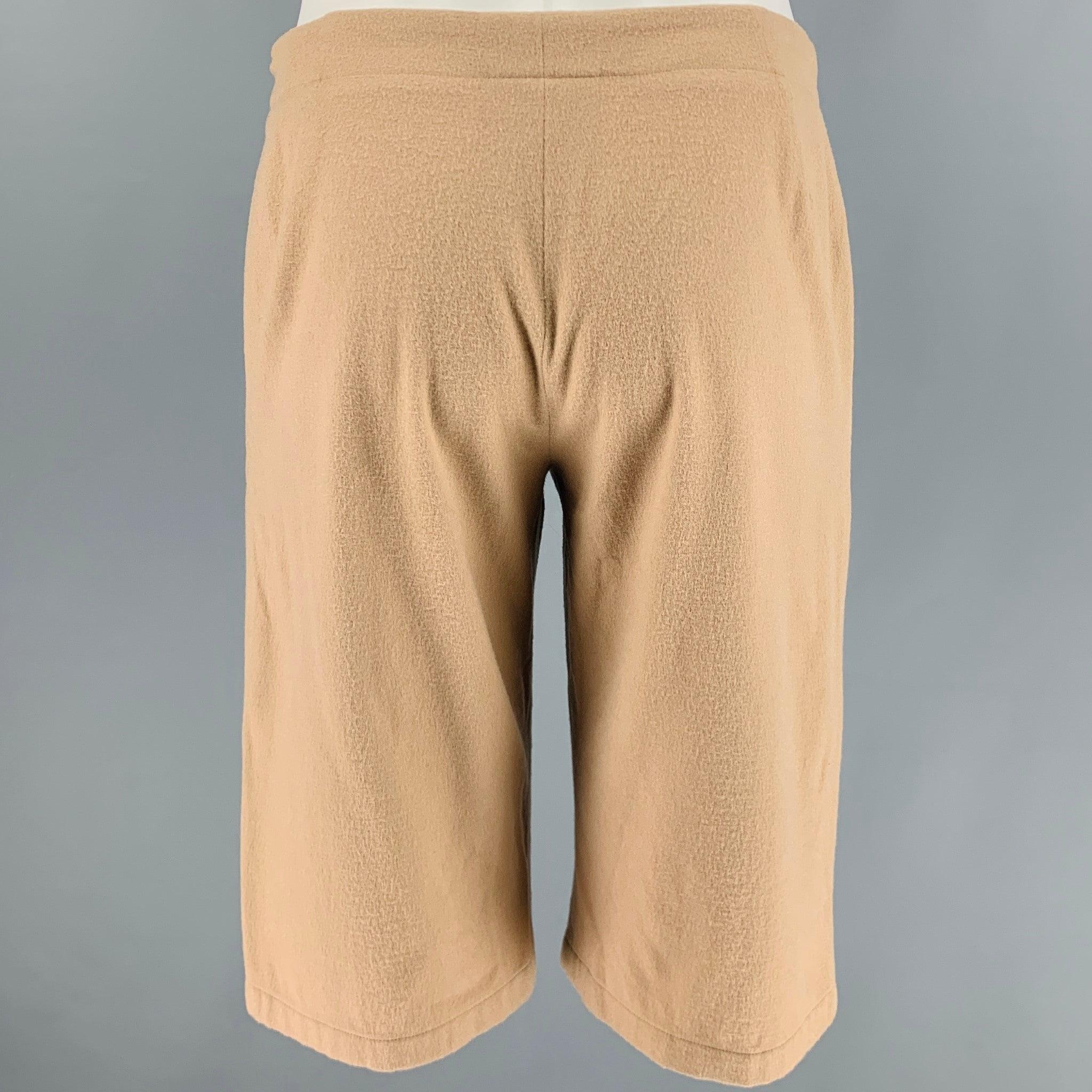 JIL SANDER shorts
in a camel wool blend fabric featuring a bermuda length, flat front style, and zip fly closure. Made in Italy.Very Good Pre-Owned Condition. Moderate signs of wear. 

Marked:   38 

Measurements: 
  Waist: 29 inches Rise: 9 inches