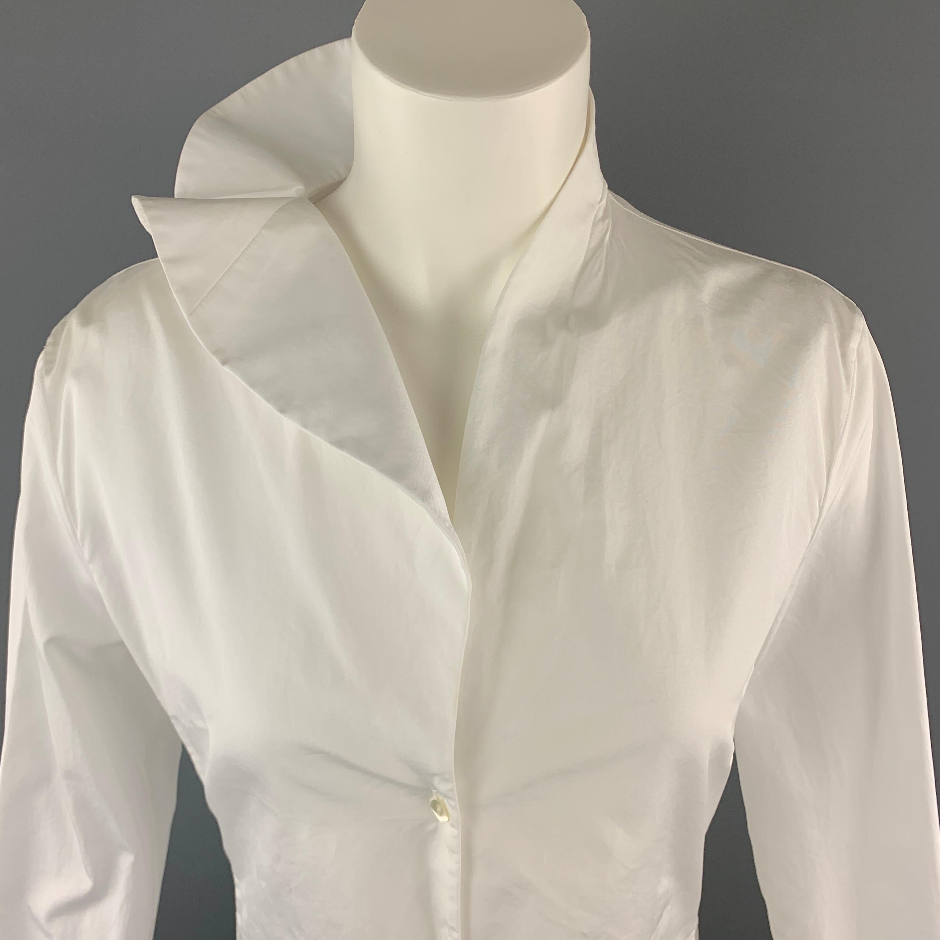 JIL SANDER Blouse comes in a white tone in a solid cotton material, with a ruffled asymmetrical collar, five buttons at closure, long sleeves, and buttoned cuffs. Wear at right cuff. Made in Italy.

Very Good Pre-Owned Condition.
Marked: IT