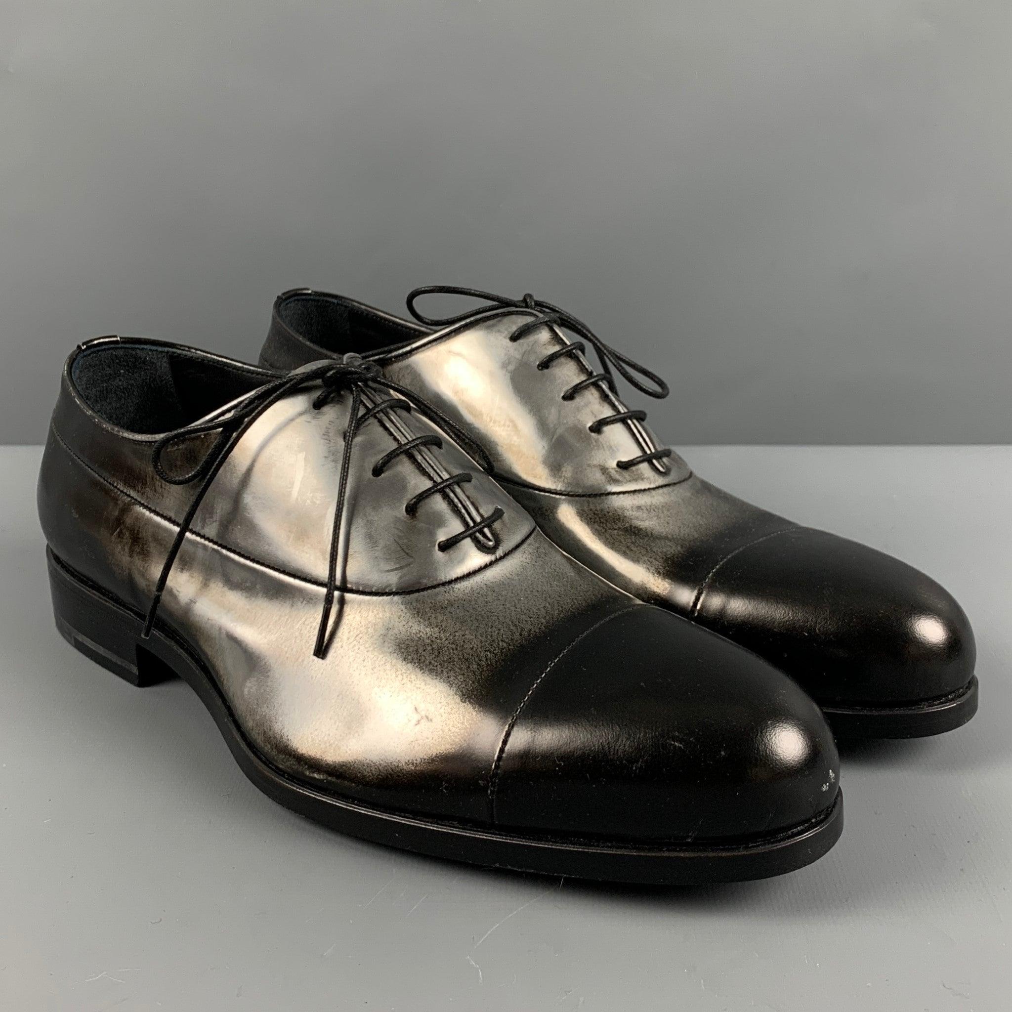 JIL SANDER shoes
in a black and silver leather featuring ombre design, and lace-up closure. Comes with dust bag. Made in Italy.New without box. 

Marked:   39.5Outsole: 10.75 inches  x 3.5 inches 
  
  
 
Reference: 127638
Category: Laces
More