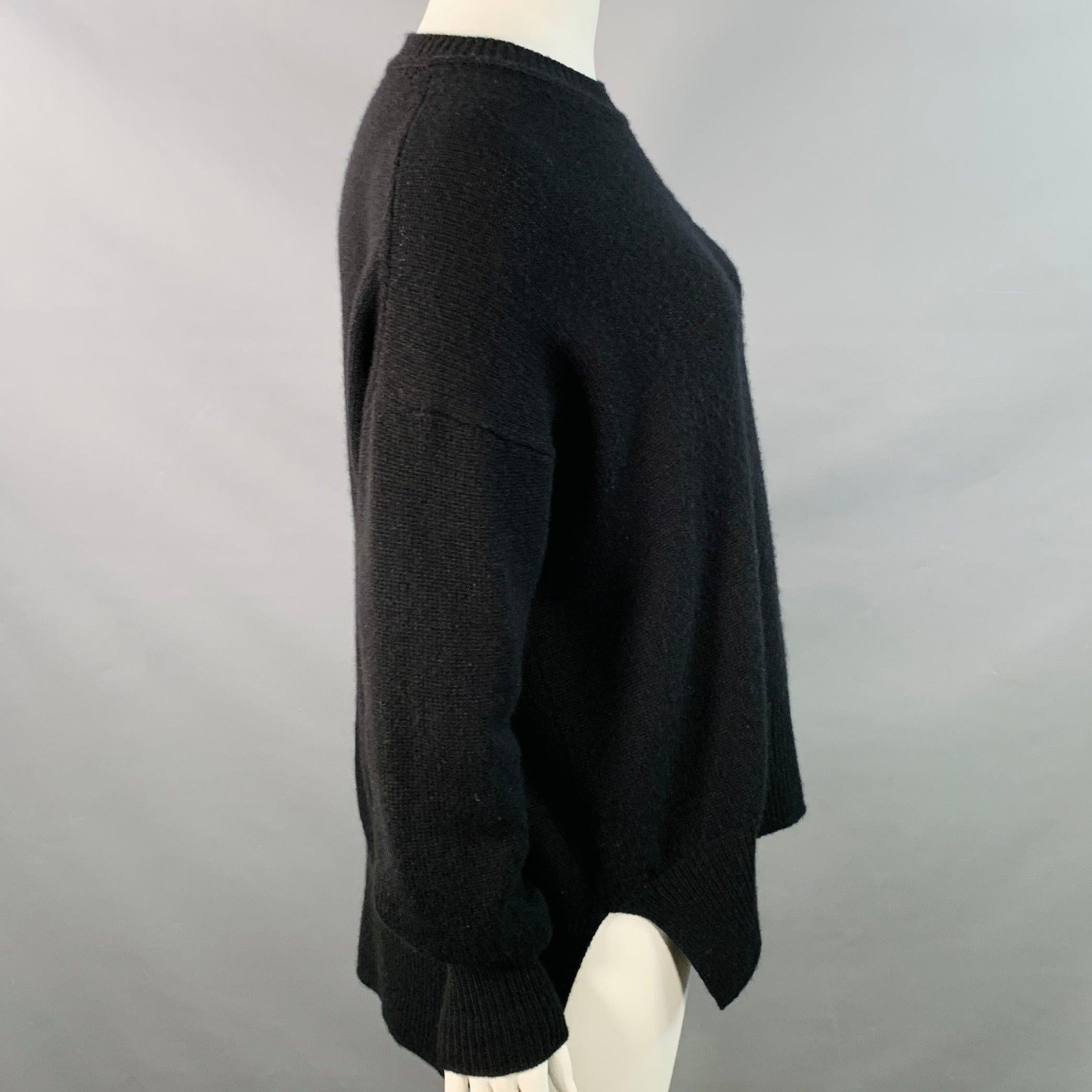 Maglione Jil Sander
in maglia di cachemire nera con maniche lunghe e girocollo.Ottime condizioni di prevendita.
Moderato pilling. Fabrice rimossa. 

Contrassegnato:   dimensioni non segnate 

Misure: 
 
Spalla: 28 pollici Busto: 59 pollici Manica: