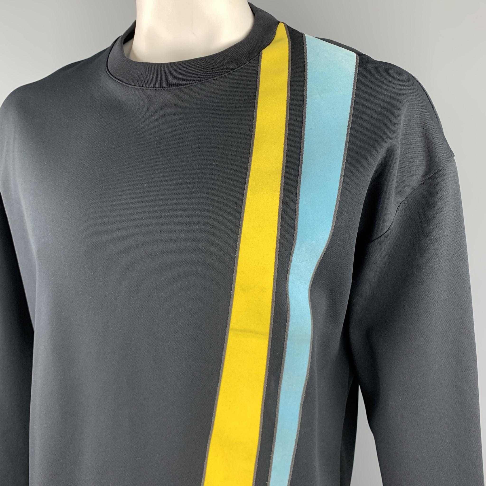 JIL SANDER pullover comes in a structured knit with a round neckline and light blue and yellow velvet textured stripe patches. Minor wear on accents. As-is. Made in Italy.

Very Good Pre-Owned Condition.
Marked: XL

Measurements:

Shoulder: 25