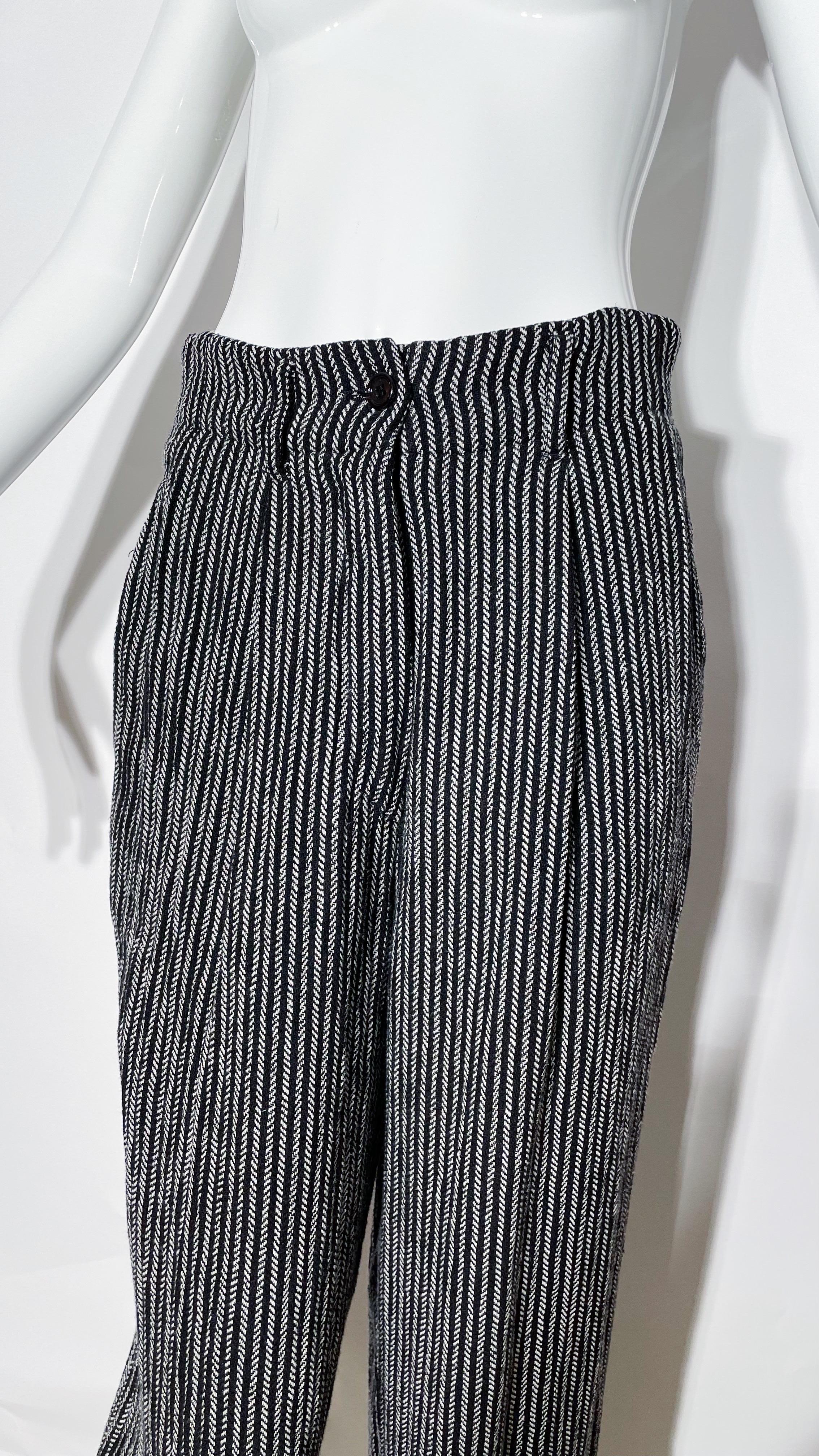 Stripe linen pants. Heavyweight. Front pockets. Front zipper closure. Rear pockets. Cropped tapered fit. Made in Italy. 
*Condition: excellent vintage condition. No visible flaws.

Measurements Taken Laying Flat (inches)—
Waist: 27 in.
Hip: 34
