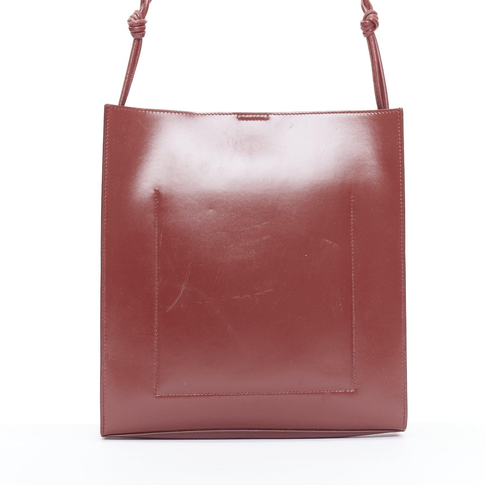 JIL SANDER Tangle burgundy knotted leather strap medium crossbody bag 1