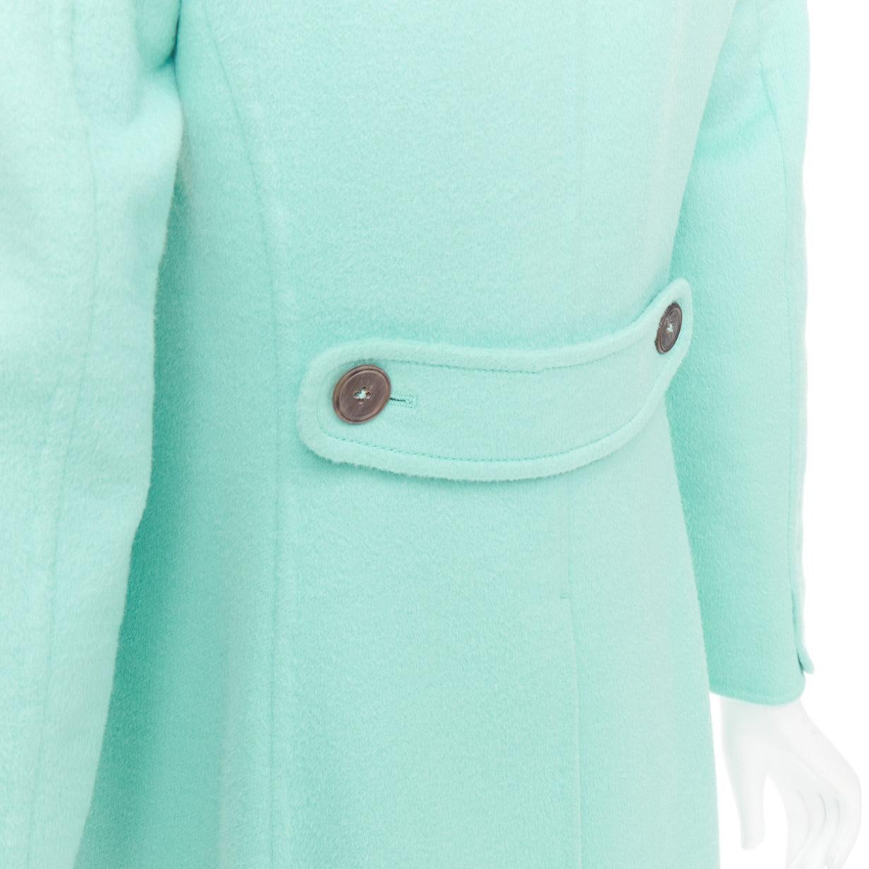 JIL SANDER turquoise blue angorawool patch pocket minimal coat  FR34 XS
Reference: CC/A00516
Brand: Jil Sander
Material: Angora
Color: Blue, Green
Pattern: Solid
Closure: Button
Lining: Black Fabric
Extra Details: Decorative button tab at back.
Made
