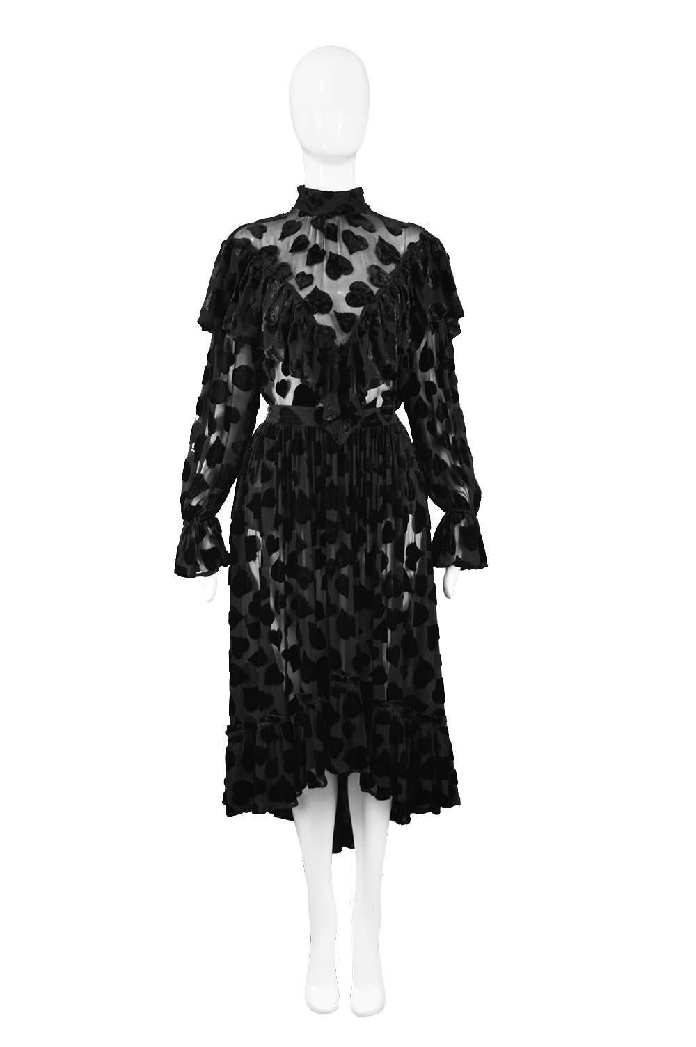 Jil Sander Vintage 1990s Semi Sheer Black Velvet Devore Two Piece Skirt Suit

Estimated Size: UK 10/ US 6/ EU 38. Please check measurements. 
Top
Bust - 38” / 96cm (has a loose flowy fit)
Length (Shoulder to Hem) - 23” / 58cm
Shoulder to Shoulder -