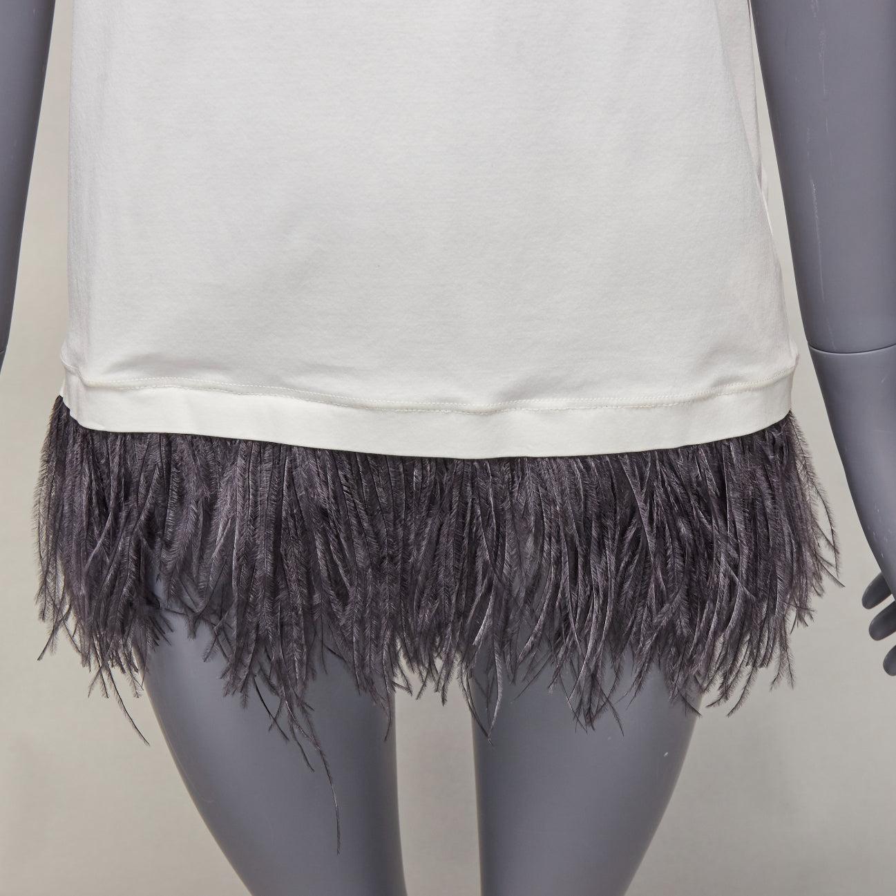 JIL SANDER white cotton black ostrich feather trim crew neck tshirt S
Reference: LNKO/A02343
Brand: Jil Sander
Material: Cotton, Feather
Color: White, Black
Pattern: Solid
Closure: Pullover
Made in: Italy

CONDITION:
Condition: Very good, this item