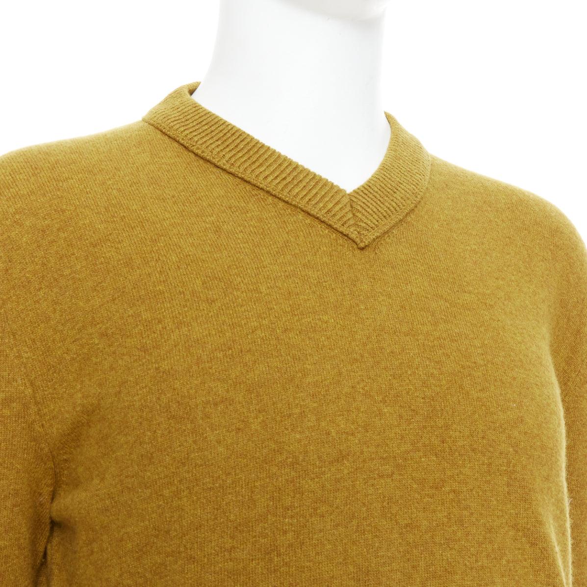 JIL SANDER wool cashmere mustard brown  v neck sweater IT46 S
Reference: PRWU/A00149
Brand: Jil Sander
Material: Wood, Cashmere
Color: Yellow
Pattern: Solid
Closure: Pullover
Extra Details: Topstitched collar detail.
Made in: