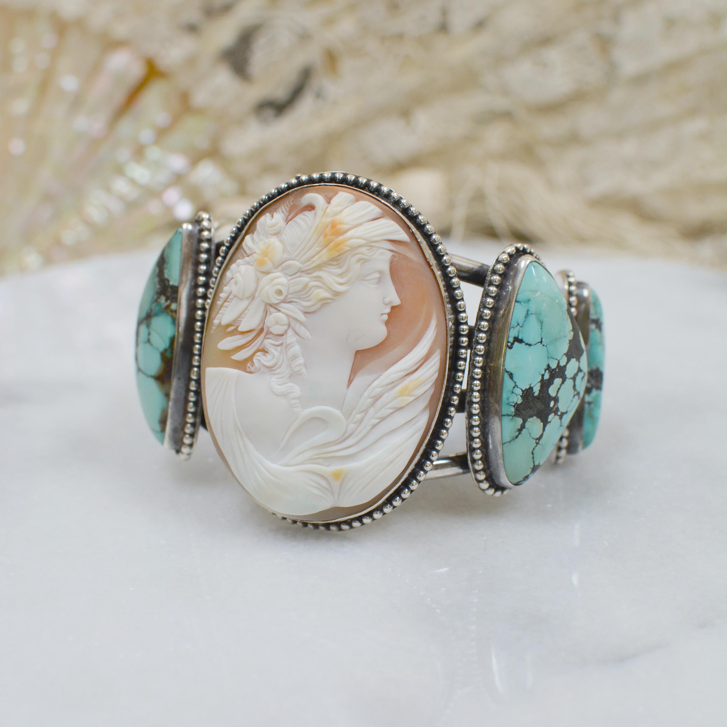 This sterling silver cuff bracelet features a very fine, hand carved nineteenth century cameo depicting the Greek goddess Leda, who was the queen of Sparta, as well as the mother of Helen of Troy, who incited the Trojan War. Upon Leda's chest is the