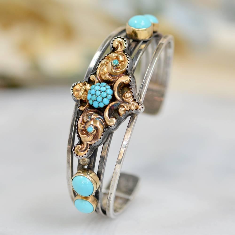 This bold one of a kind Sterling Silver five band cuff bracelet features a fine antique Georgian period 14 karat gold with Persian turquoise brooch at its center. On either side of this wonderful bracelet are two 8 mm and two 6 mm bezel mounted