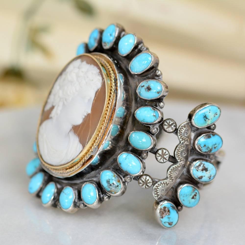 This one of a kind Sterling Silver cuff bracelet features a fine antique nineteenth century Victorian Goddess cameo in original 14 karat gold mounting. Surrounding this exquisite piece are nineteen 9 x 7 mm oval Sleeping Beauty turquoise cabochons,