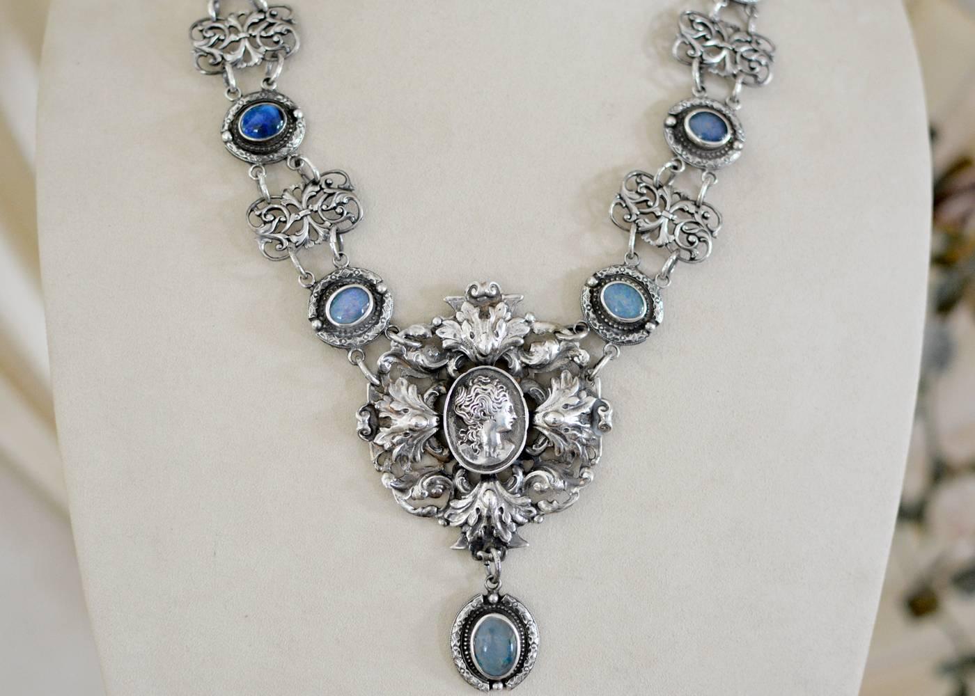 This one of a kind Bohemian drop necklace features a finely crafted figural pendant with delicate pierced work dating to the Victorian period. A Goddess surrounded with classic French architectural ornament, the festoon drop with engraved pattern