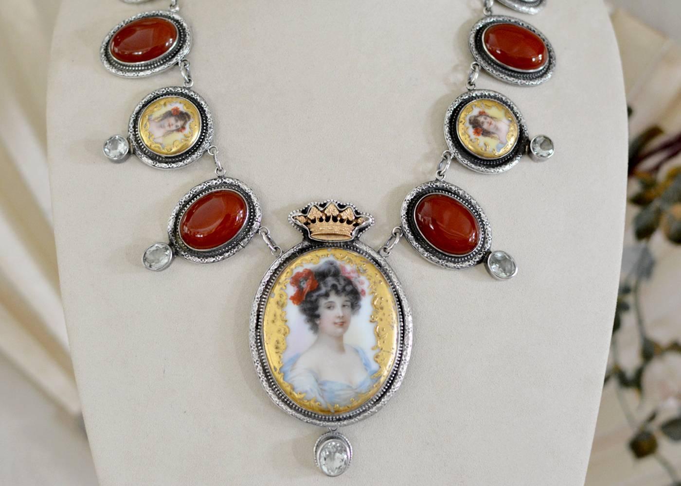 A French Limoges porcelain portrait, highly detailed with gold enamel forms the beautiful central element of this one of a kind drop necklace. A Goddess so lovely and regal that we have given her a bronze crown and added a faceted natural green