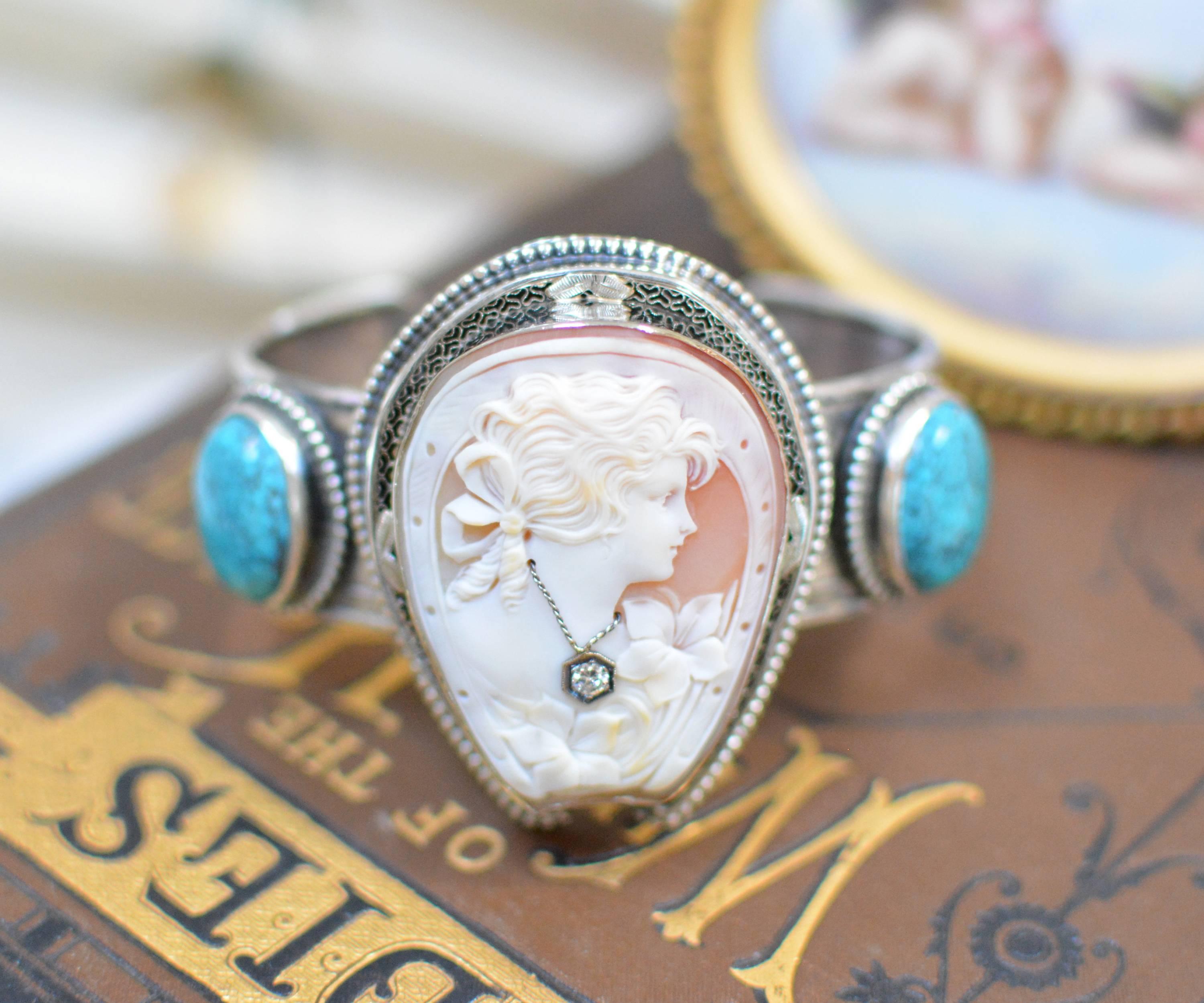 This sterling silver cuff bracelet features an antique period finely hand carved cameo depicting a lovely girl framed within a horseshoe. Wearing a natural diamond necklace, she is mounted in a filigree frame of 14 karat white gold, then edged in