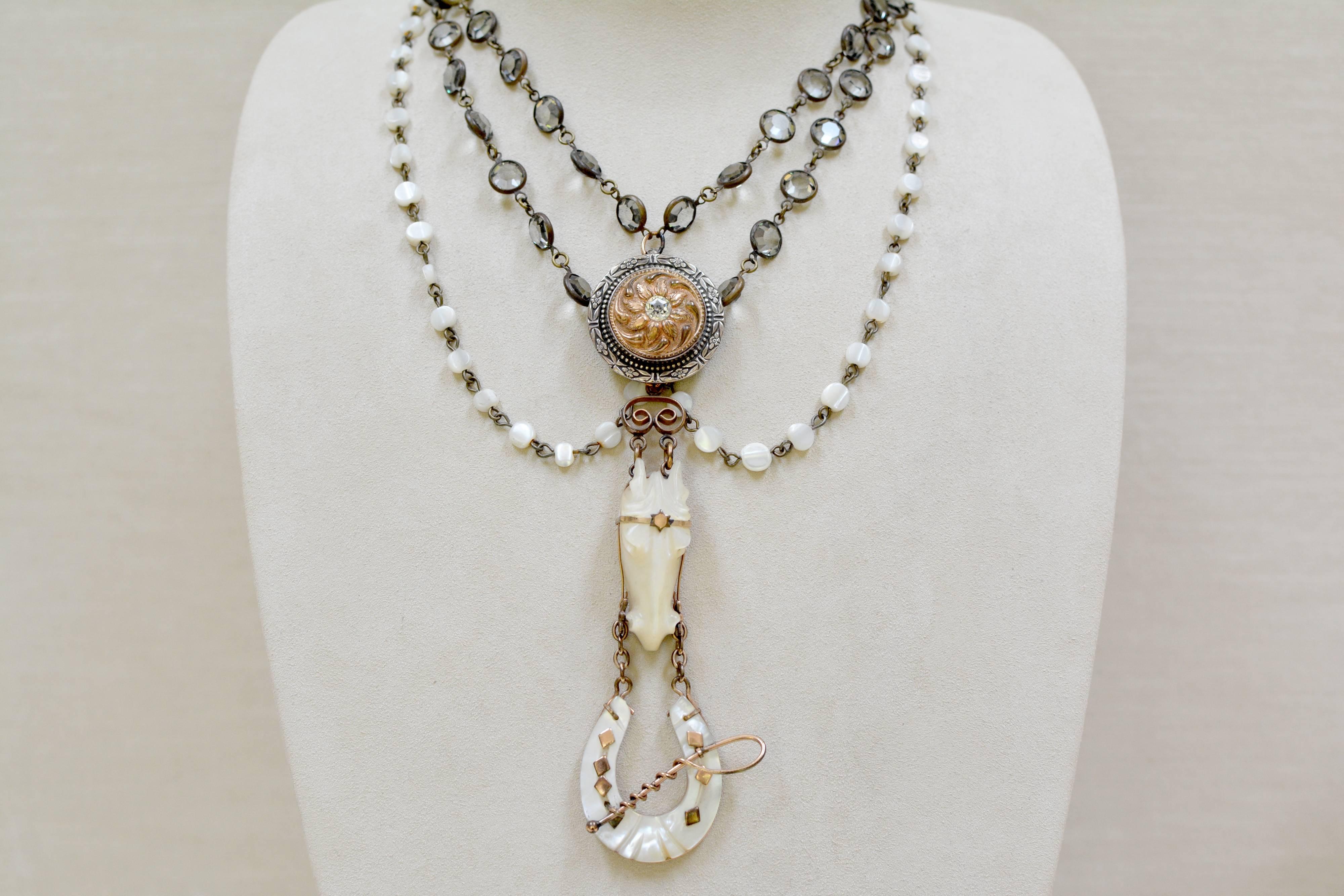 At the center of this one of a kind Love Token Festoon necklace is an antique Victorian Mother-of-Pearl watch fob which was custom made for a Montana rancher around the turn of the century. Rose Gold details highlight the very dimensional carved