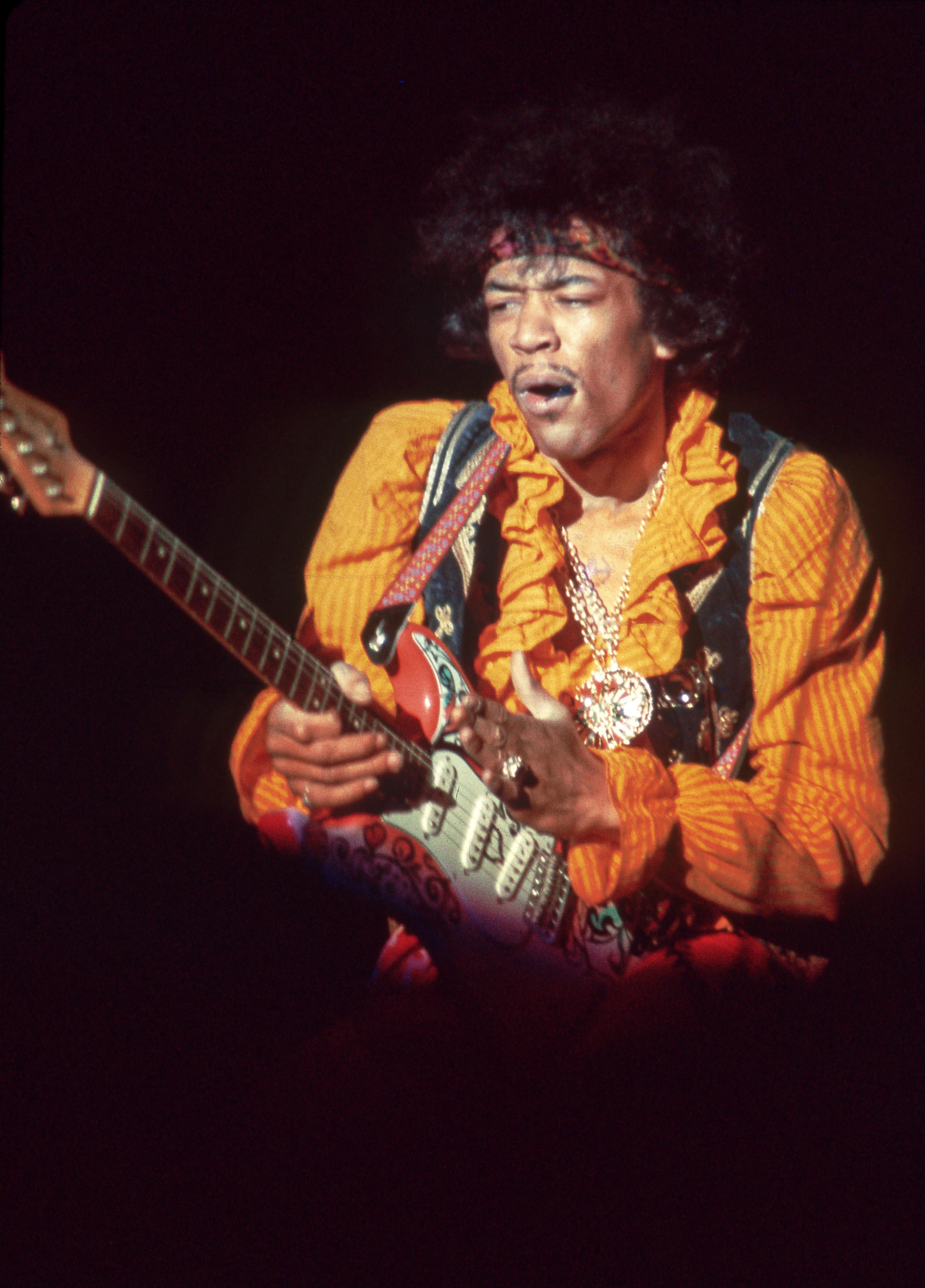 Jill Gibson Color Photograph - Jimi Hendrix with Pick in Mouth Monterey Pop Festival Fine Art Print