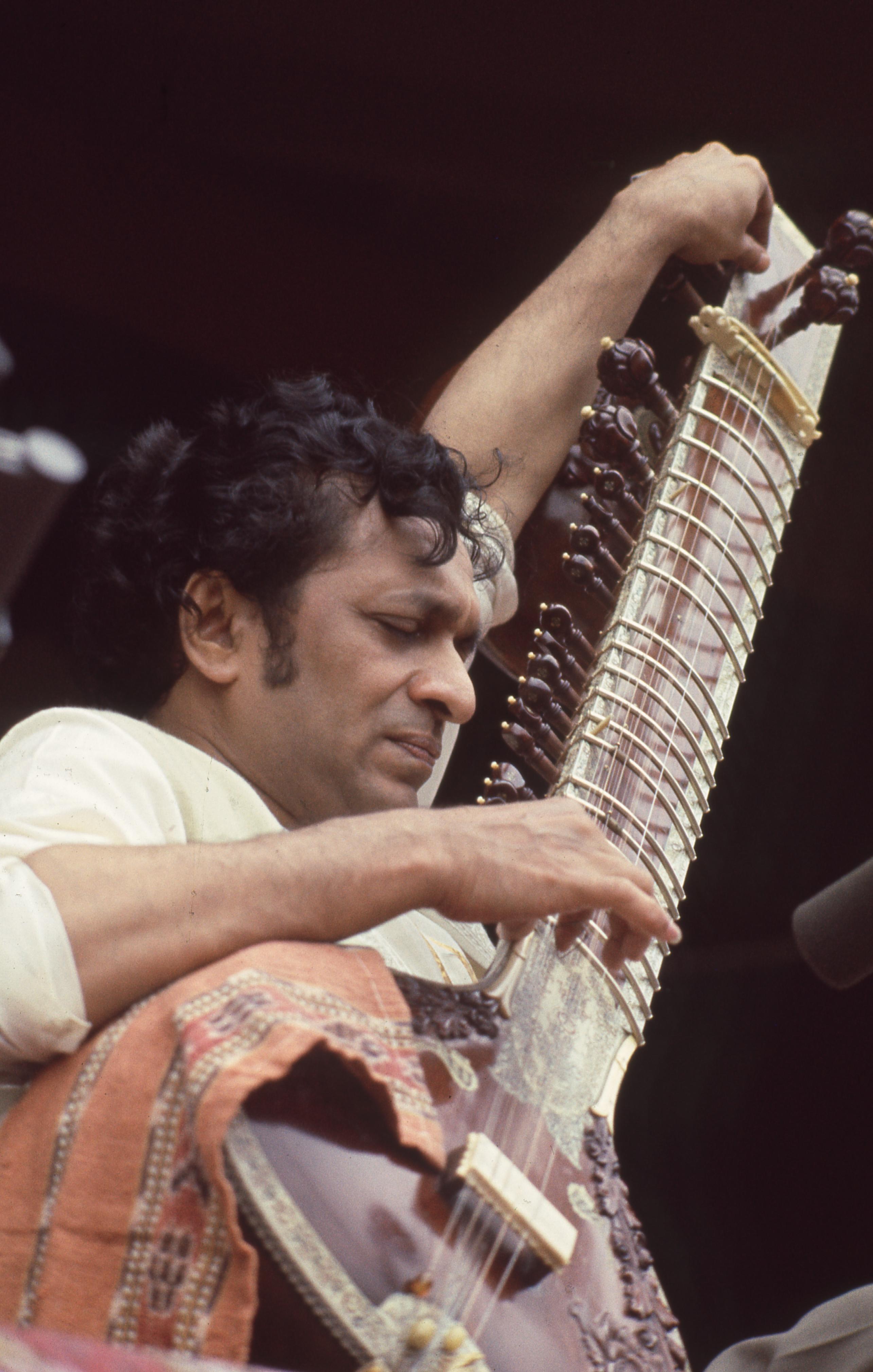 Jill Gibson Portrait Photograph - Ravi Shankar Playing Sitar at Monterey Pop Festival Fine Art Print