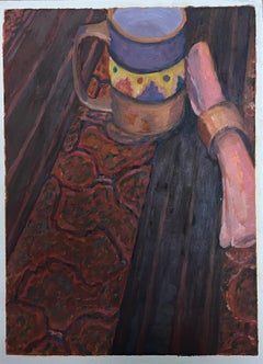 Ceramic Mug and Rolled Cloth Resting on a Dark Wooden Table with Ornate Rug