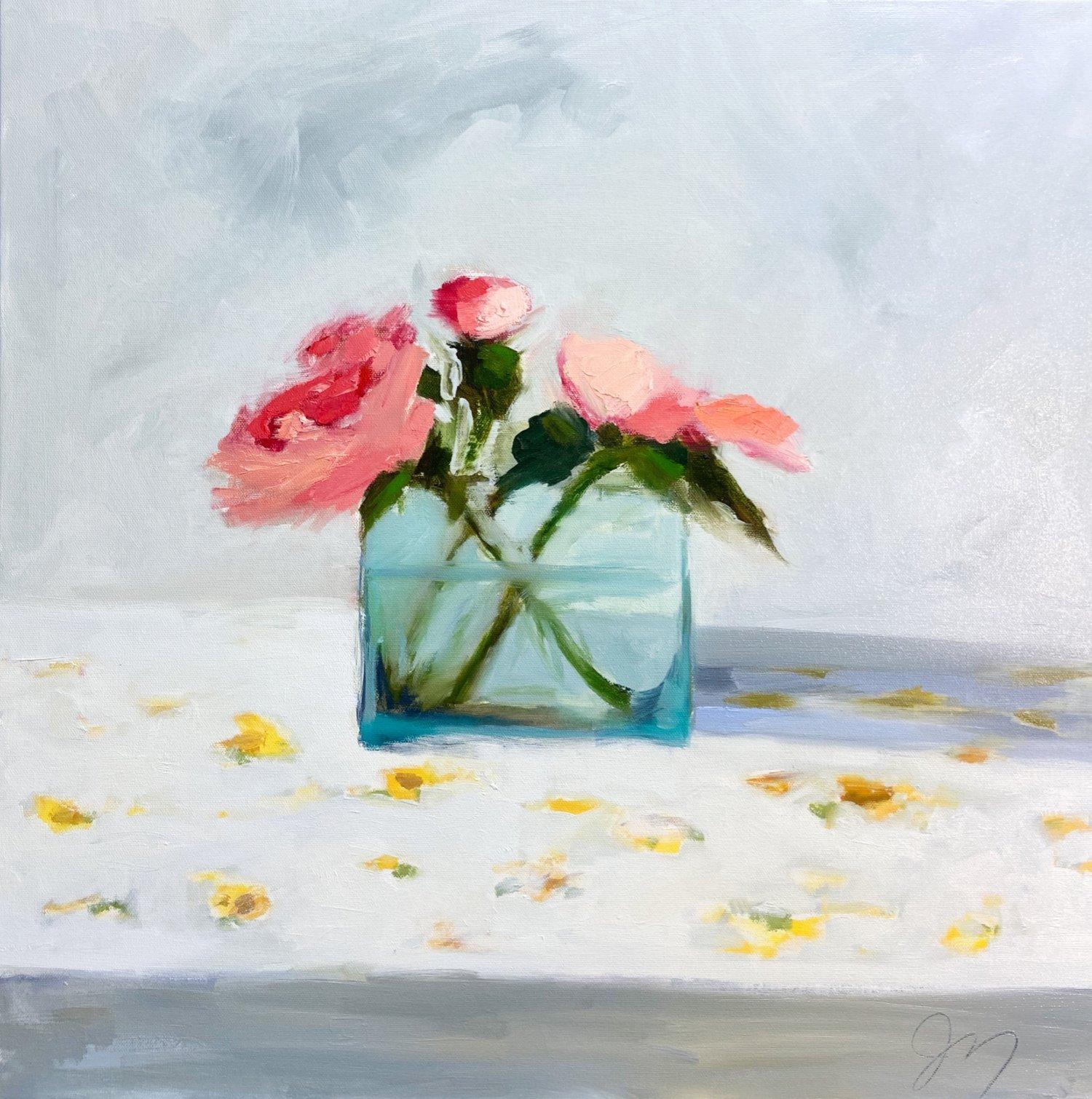 This fresh and airy bouquet piece, "Pink Peonies" is a 24x24 oil painting on canvas by artist Jill Matthews. Depicted is an impressionistic pink peony bouquet in a clear crystal blue vase. A yellow daisy-patterned tablecloth and white background