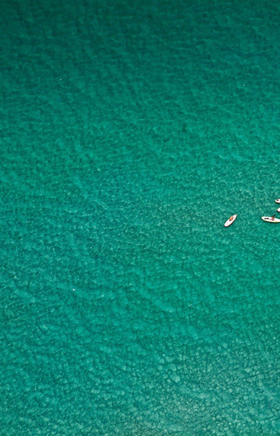 Paddle Boarders. Areal Landscape ocean limited edition color photograph - Blue Landscape Photograph by Jill Peters