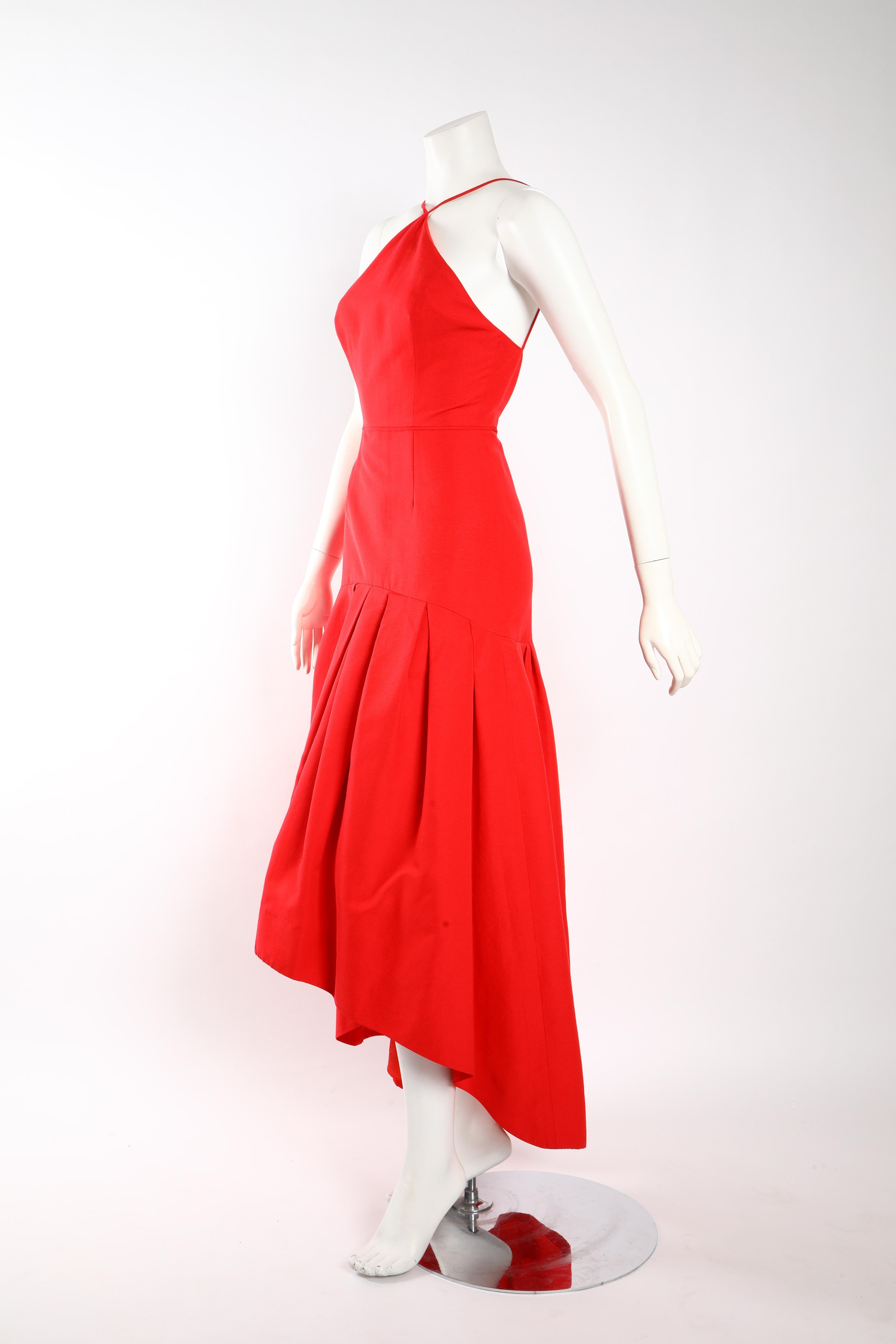 Red gown by Jill Stuart with skinny straps which meet at the center of the collarbone and an asymmetric hemline. Bodice is fitted and flares out at the hip. 
Super flattering on all body types. 
Size US 2. 