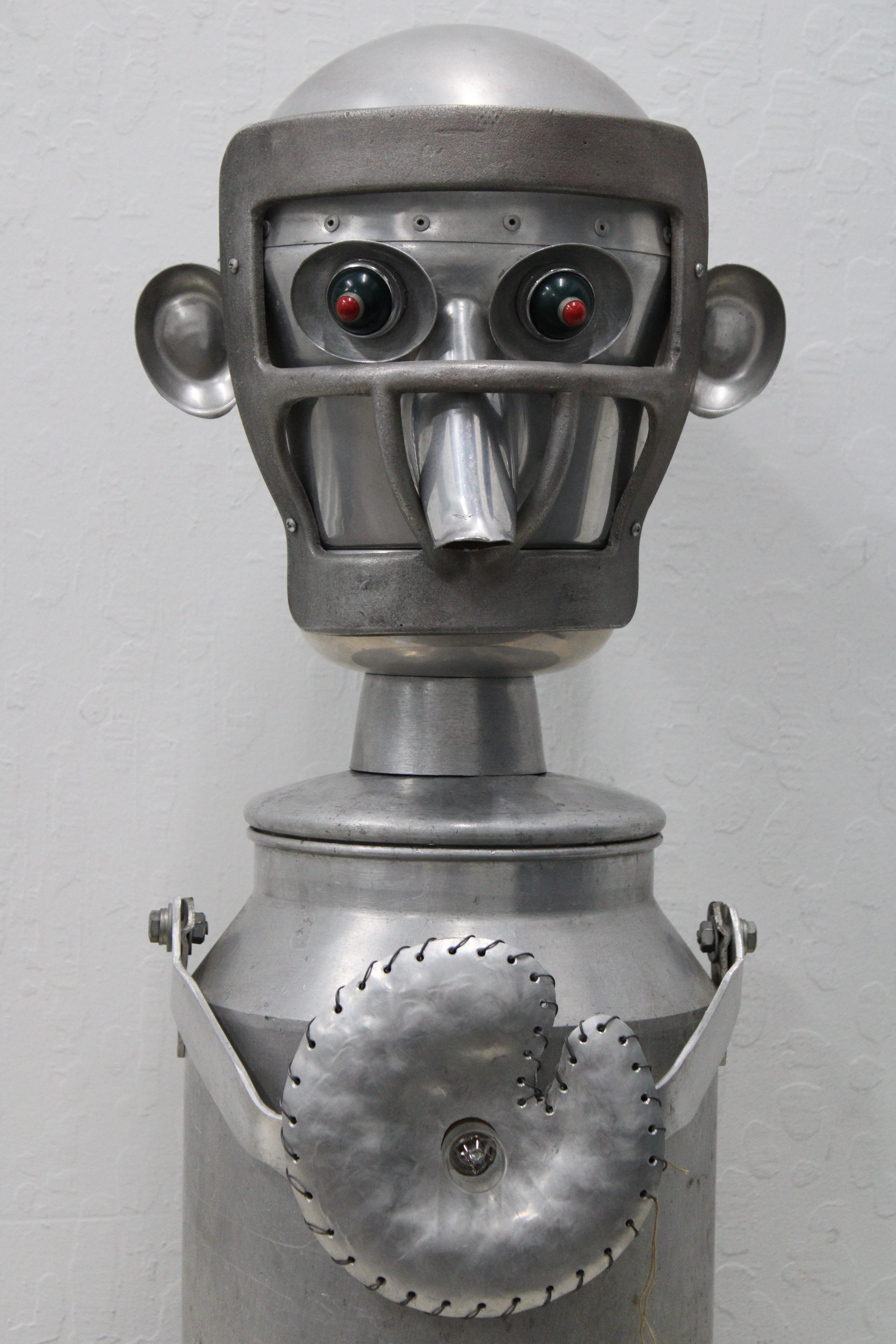 C. 20th Century

Jim Bauer Hand Made Tin Robot ( Signed )

This Tin Robot Plugs in and Lights up ( Lights on Stomach & Eyes ).