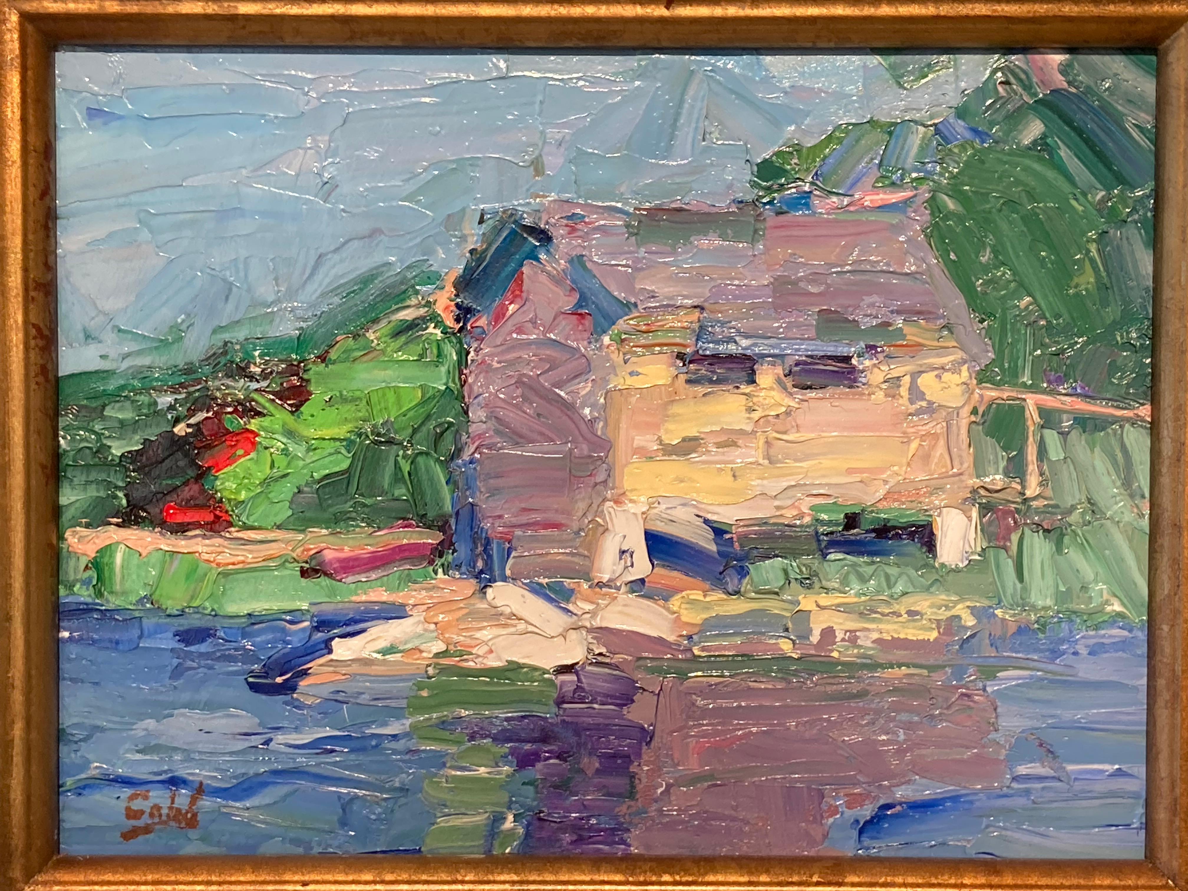 This oil on masonite painting by James Cobb features a stand-alone home on the edge of a waterway. The house's reflection melts into the water where the colors of blue, gray, and purple blend together. In the background a light blue sky hides behind