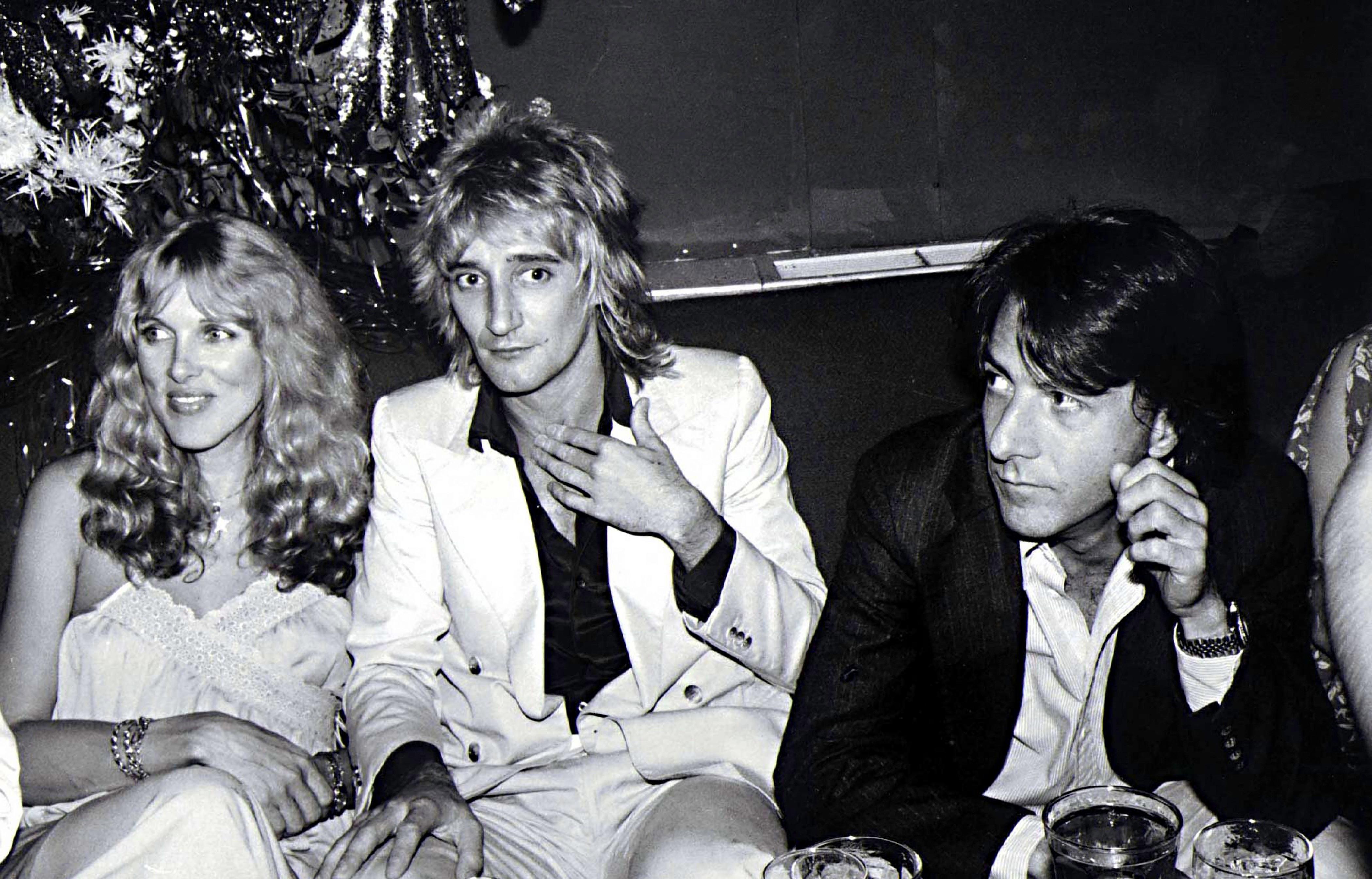 Jim Colburn Black and White Photograph - Dustin Hoffman, Rod Stuart, and Alana Stuart at Studio 54 Fine Art Print