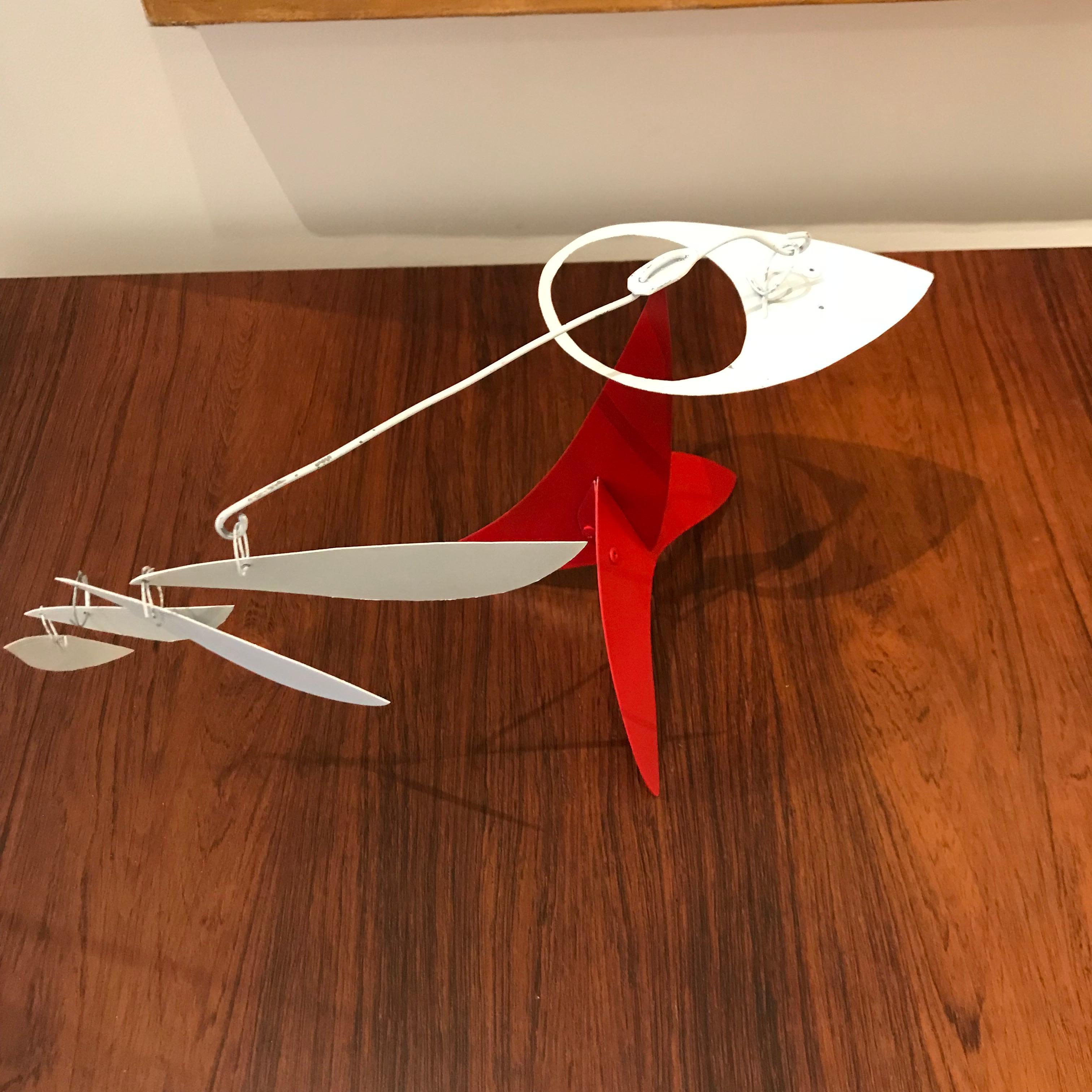 Abstract sculpture of cut and painted steel, perfectly balanced on a pointed base, created 2018. Hunter (born 1963) studied advertising art on the west coast, becoming a graphic designer in Santa Barbara before moving to New York City to work for