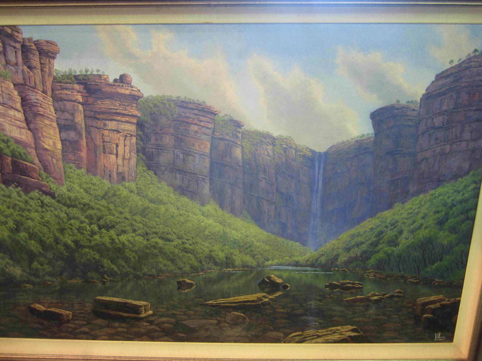 James Hardy, Jim Jim Falls, Kakadu,
oil on board, signed bottom right,
Measures: Image 150 x 90 cm, frame 174 x 117 cm
This is an image of a very remote part of Australia.