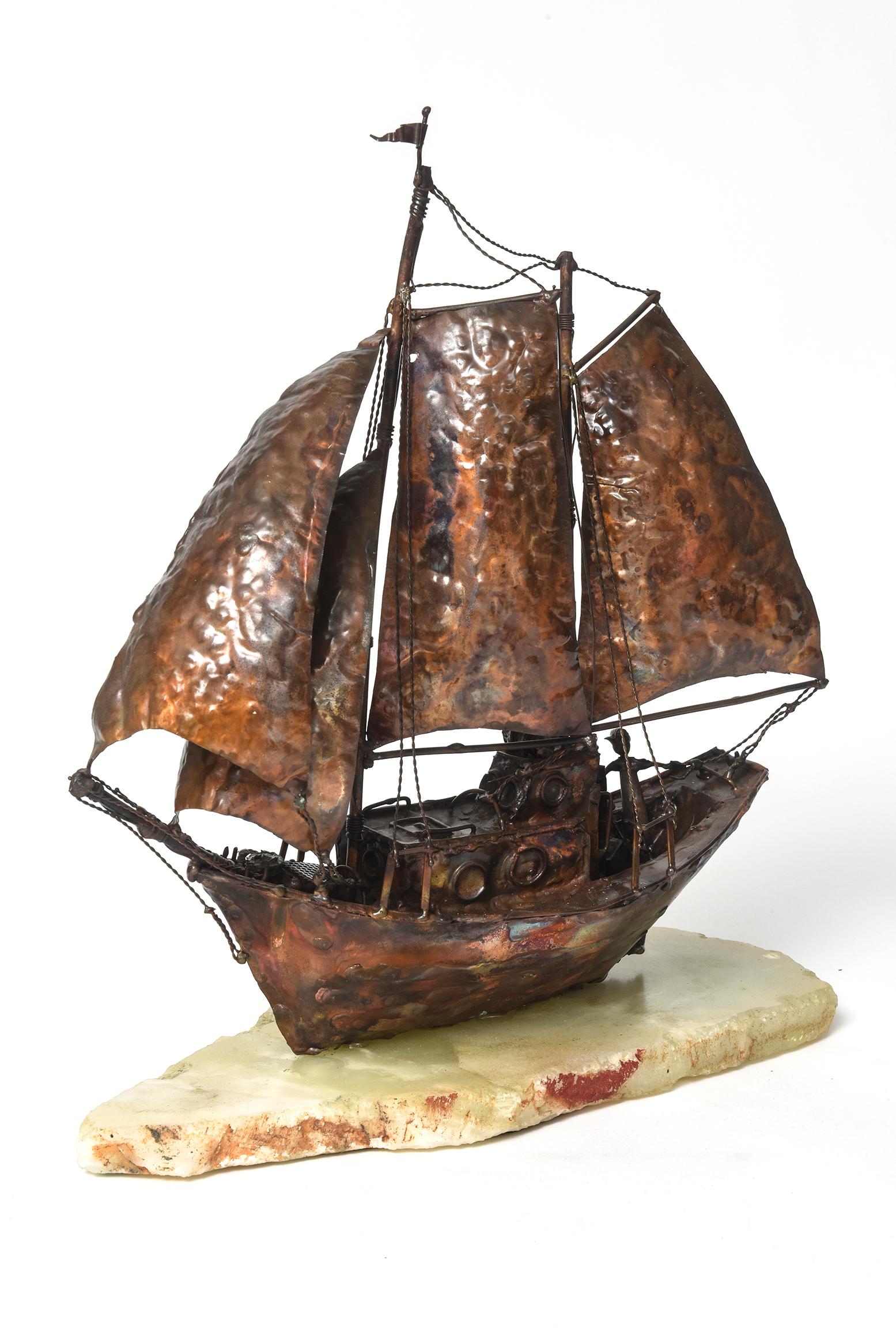 Wonderful nautical sculpture by artist Jim Lewk featuring a beautiful copper sailboat sailing with sails full of wind and captain at the wheel.

Signed J. Lewk 1975 on the marble base.

Jim Lewk Sculptor Biography:
Biography Born in Troyes, France