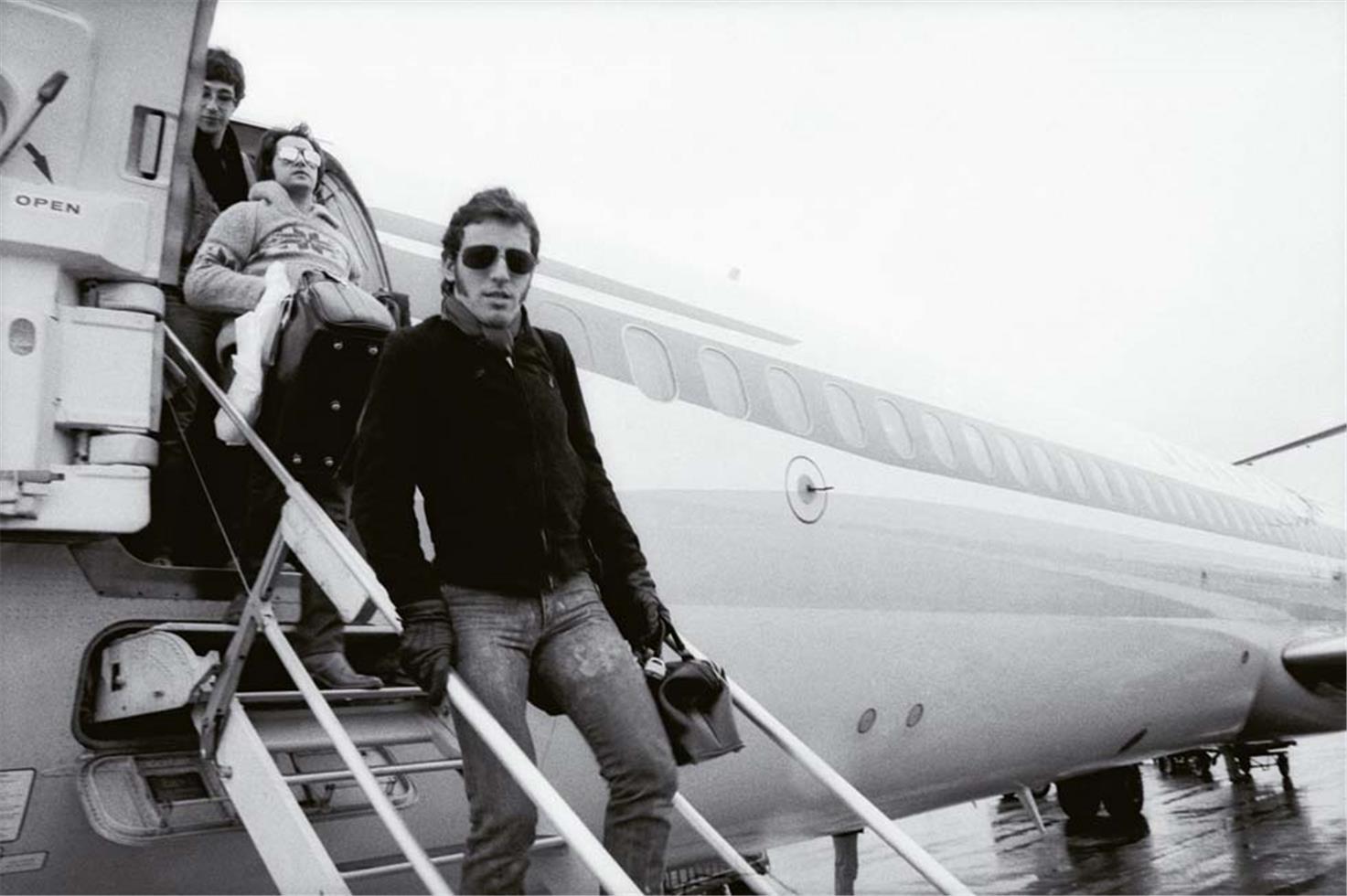 Jim Marchese Black and White Photograph - Coming off the Plane, Bruce Springsteen