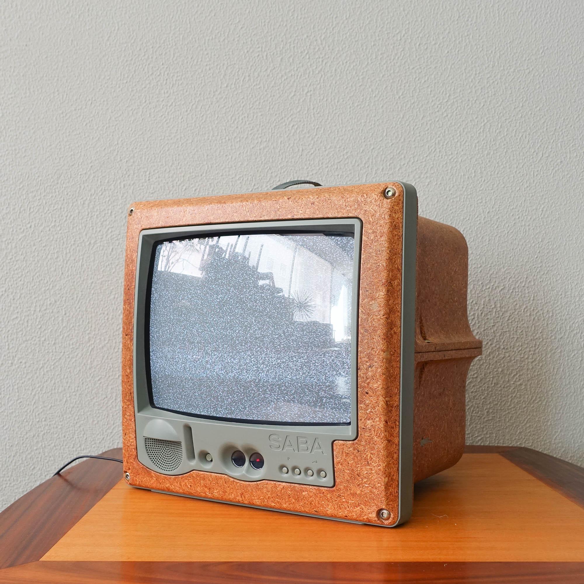 This portable television 'Jim Nature' was designed by Philippe Starck for Saba in France, in 1994. 
At a time when black plastic was the predominant material for making casing for electrical goods, French industrial designer Philippe Starck opted