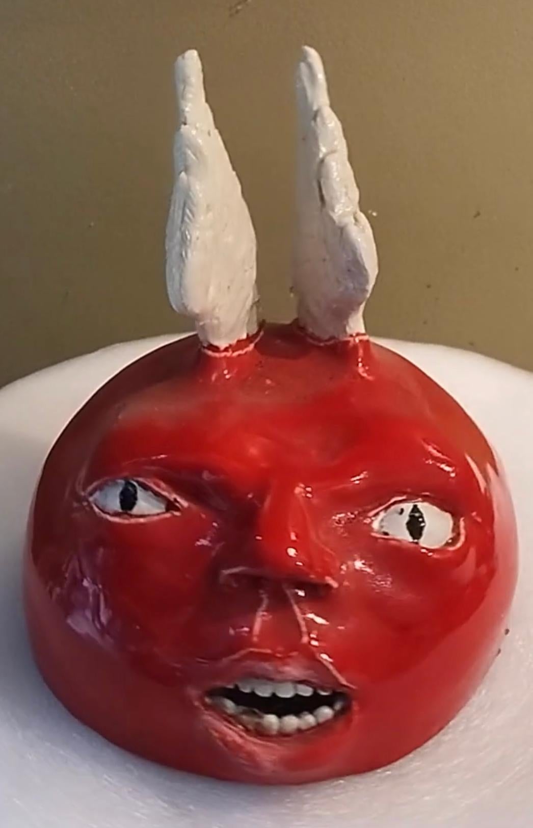 Artist: Jim Pallas (1941)
Title: Red devil (no ears)
Year: 2021
Medium: Glazed ceramic
Size: 8 x 7 x 7 inches
Condition: Excellent
Inscription: Signed and dated

JIM PALLAS (1941-) American painter, draughtsman, sculptor, and printmaker. An