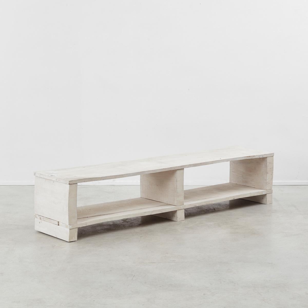 Jim Partridge (1953-) and Liz Walmsley (1952-) started collaborating in 1986. Carved from blocks of green oak and then stained in a white finish, the shelving unit’s light tone yet solid aesthetic follows their intention to make “work with a strong